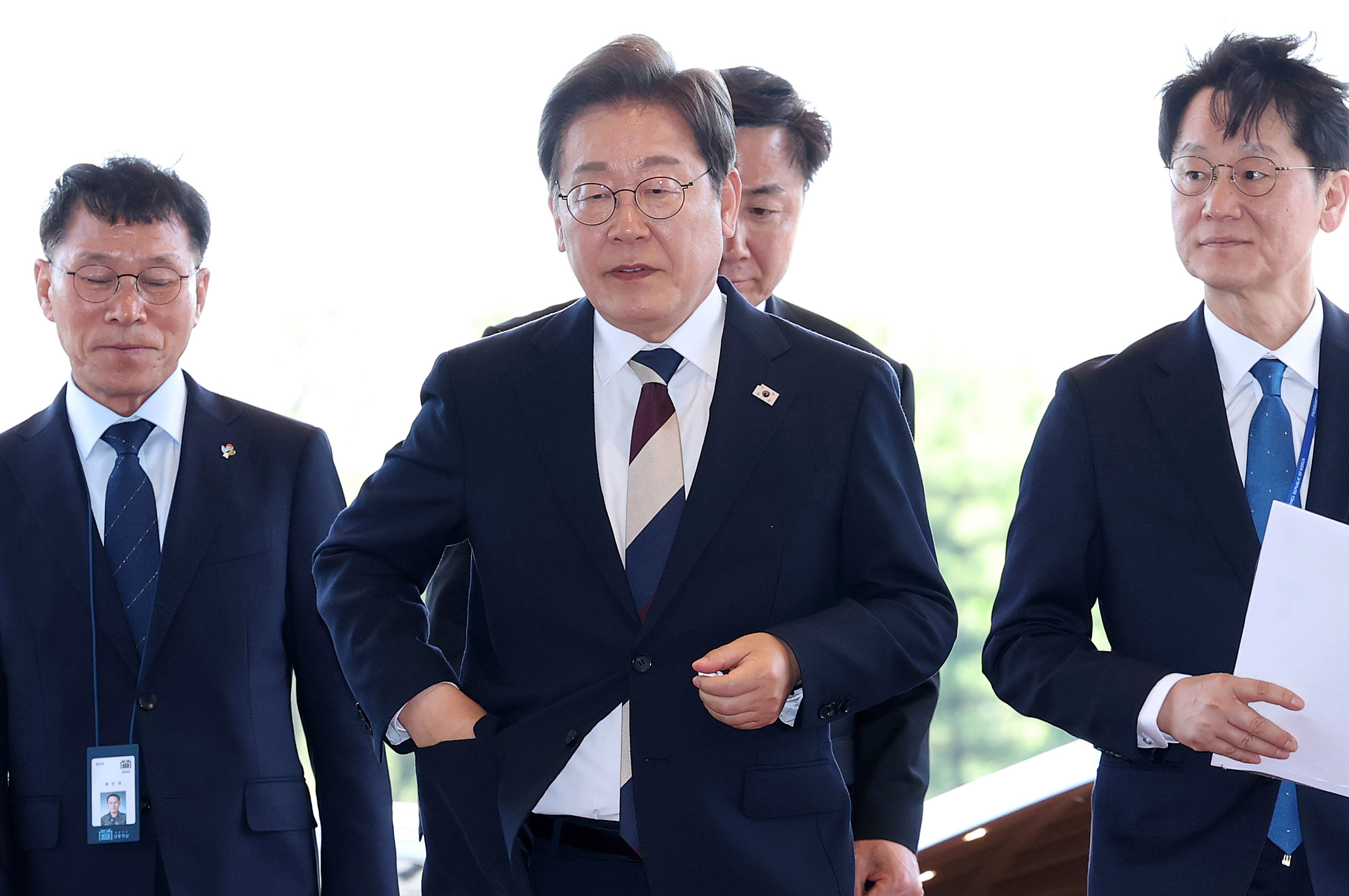 South Korean new President Lee Jae-myung, center, arrives at presidential office in Seoul after the inauguration Wednesday, June 4, 2025. (Chung Sung-Jun/Pool Photo via AP)