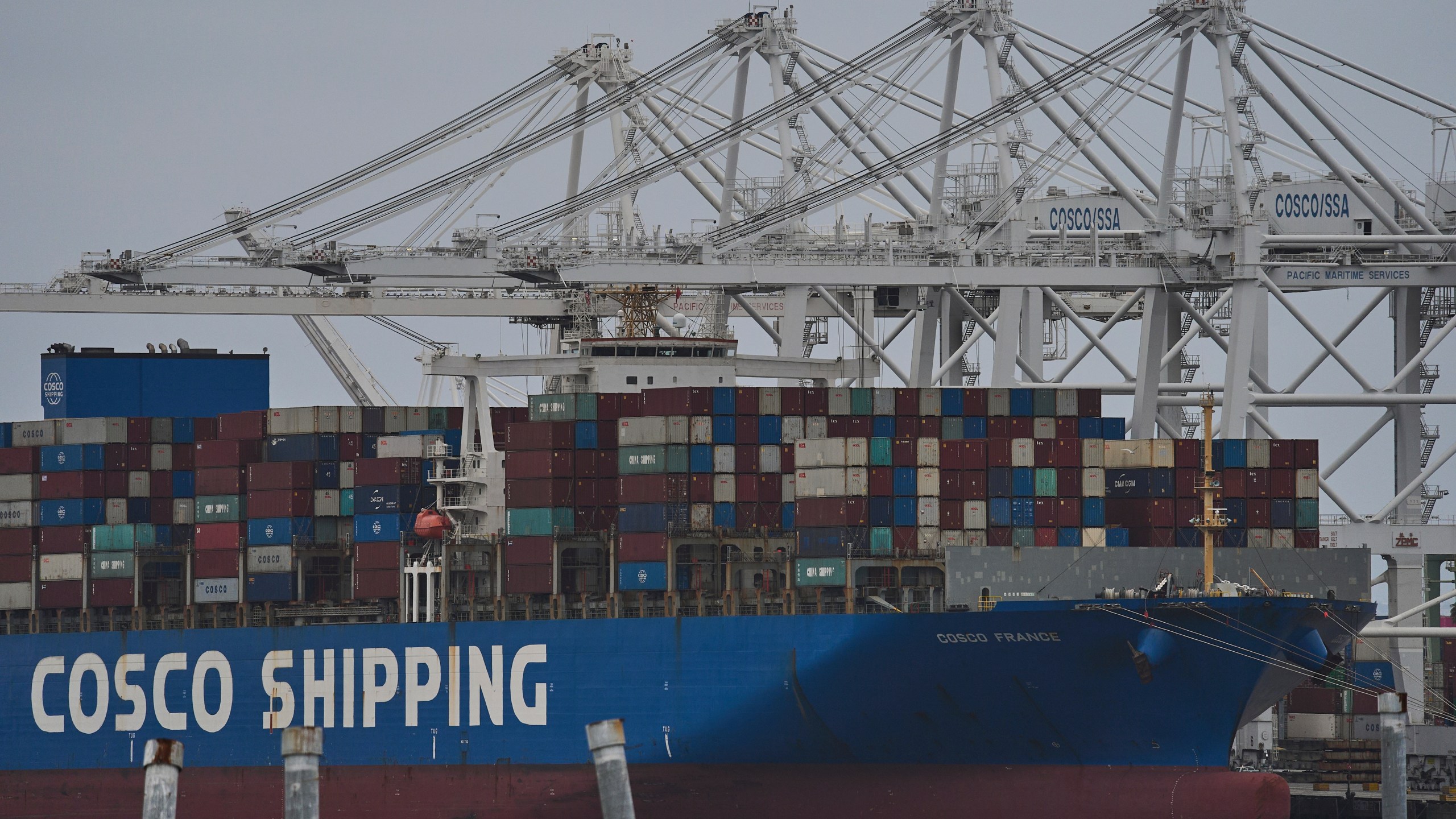 FILE -The "Cosco Shipping France" container ship is moored at the Long Beach Container Terminal, LBCT, at Middle Harbor in the Port of Long Beach, Calif., , April 15, 2025. (AP Photo/Damian Dovarganes, File)