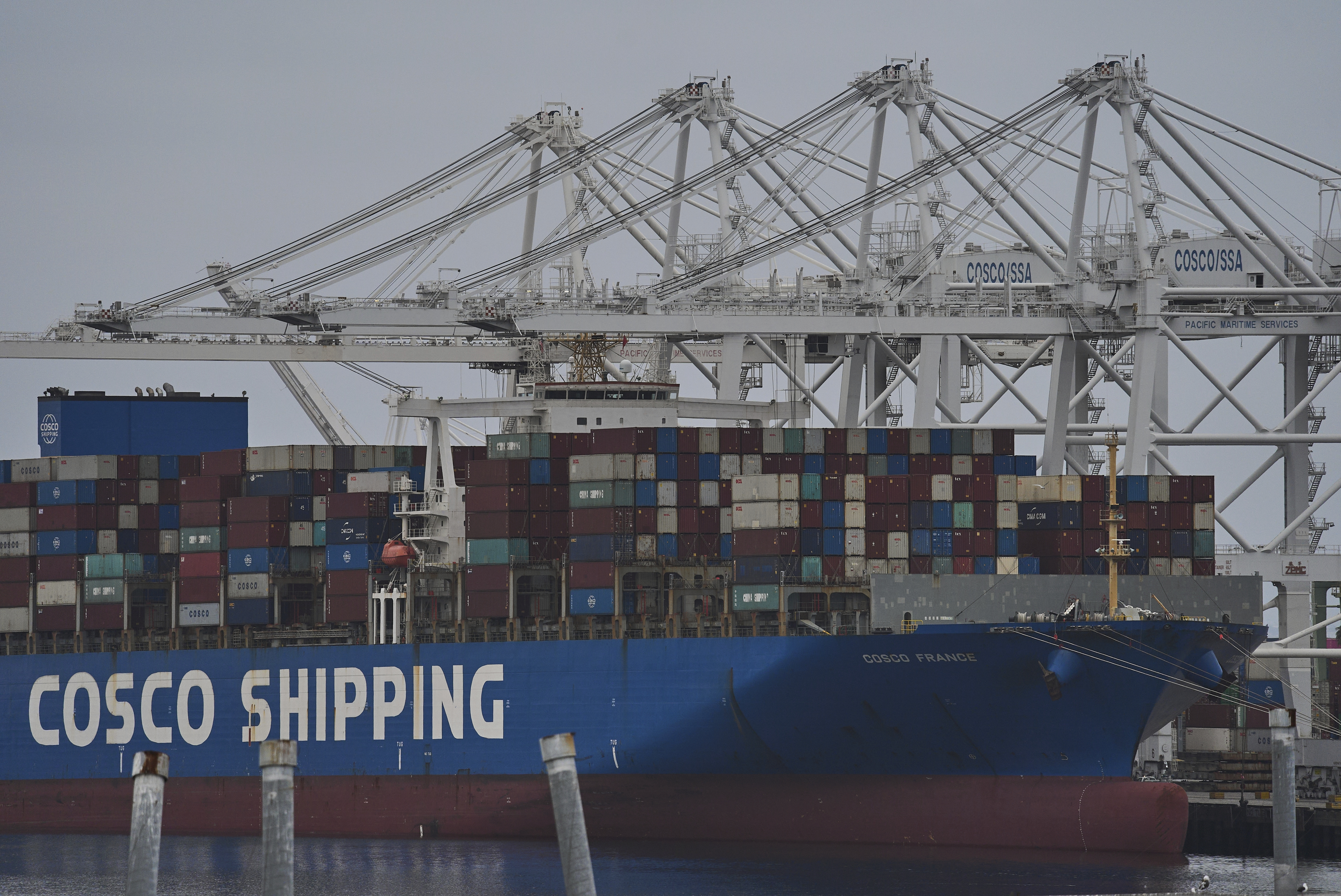 FILE -The "Cosco Shipping France" container ship is moored at the Long Beach Container Terminal, LBCT, at Middle Harbor in the Port of Long Beach, Calif., , April 15, 2025. (AP Photo/Damian Dovarganes, File)