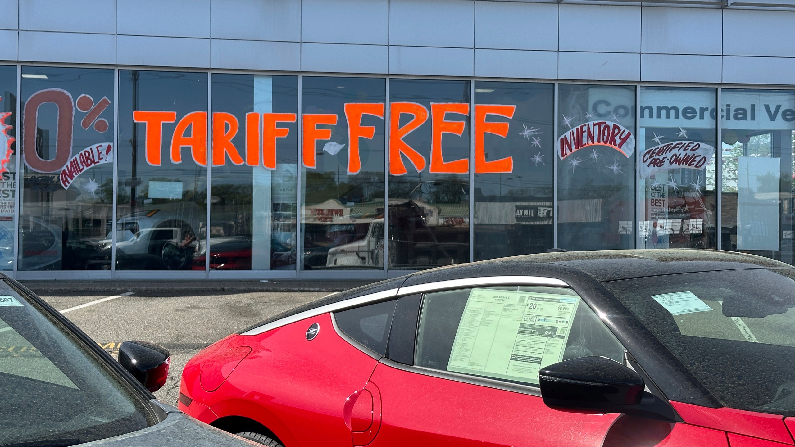 FILE - A Tariff Free sign to attract vehicle shoppers is at an automobile dealership in Totowa, N.J., on April 30, 2025. (AP Photo/Ted Shaffrey)