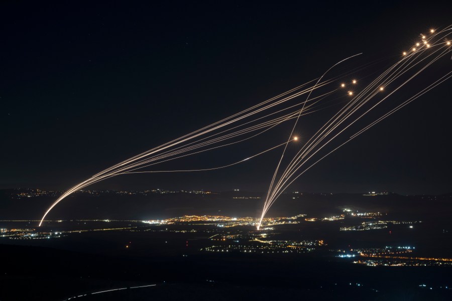 FILE - The Israeli Iron Dome air defense system fires to intercept an attack from Lebanon over the Galilee region as seen from the Israeli-annexed Golan Heights, Aug. 4, 2024. (AP Photo/Leo Correa, file)
