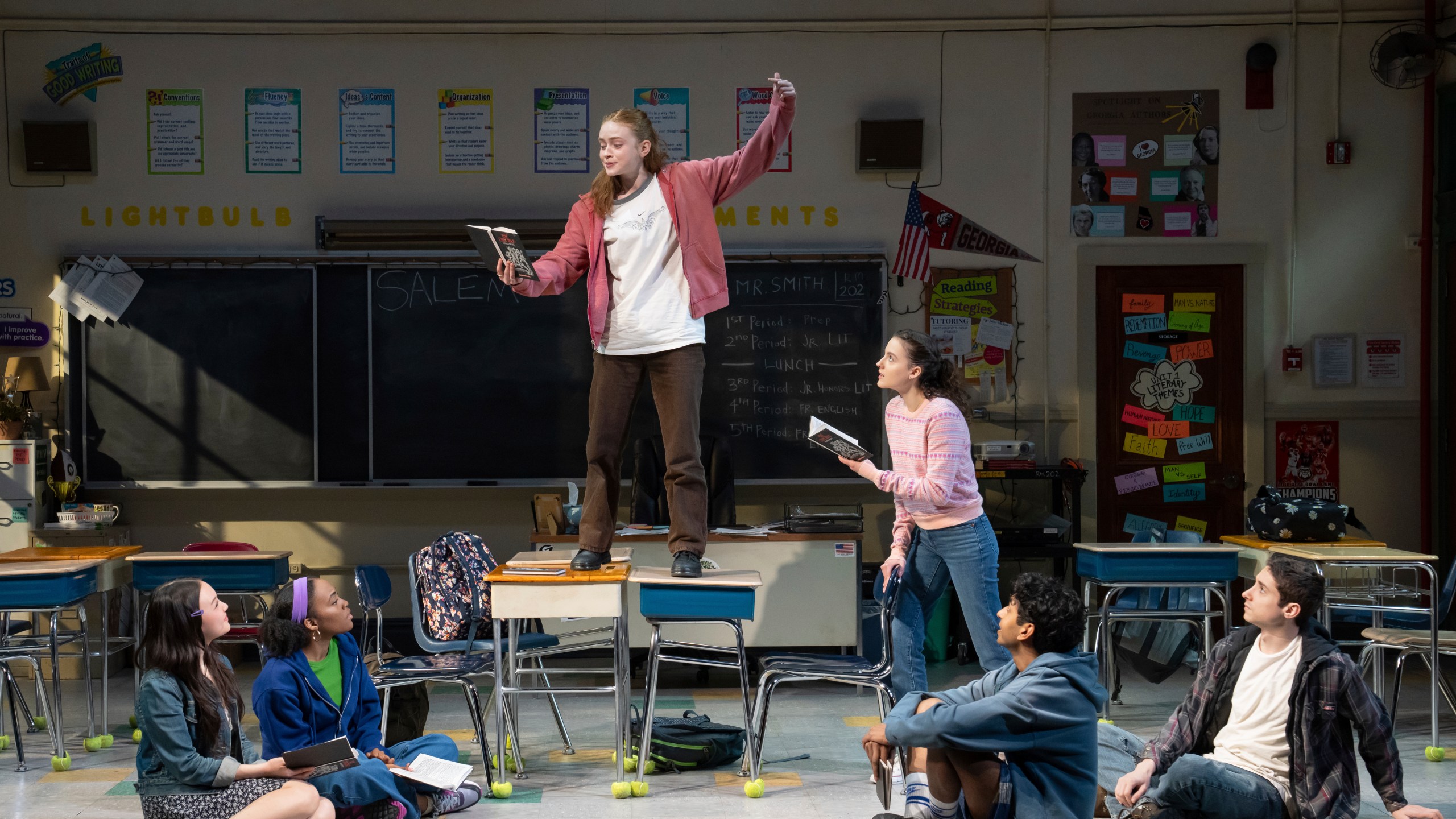 This image released by O&M/DKC shows, from left, Amelia Yoo, Morgan Scott, Sadie Sink, Fina Strazza, Nihar Duvvuri and Hagan Oliveras during a performance of "John Proctor Is the Villain" in New York. (Julieta Cervantes/O&M/DKC via AP)