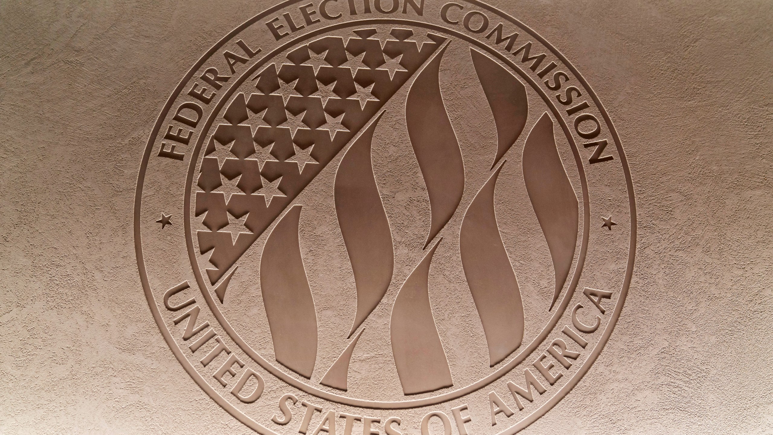 FILE - The Federal Election Commission emblem is seen at the Federal Election Commission headquarters in Washington, Aug. 10, 2023. (AP Photo/Stephanie Scarbrough, File)