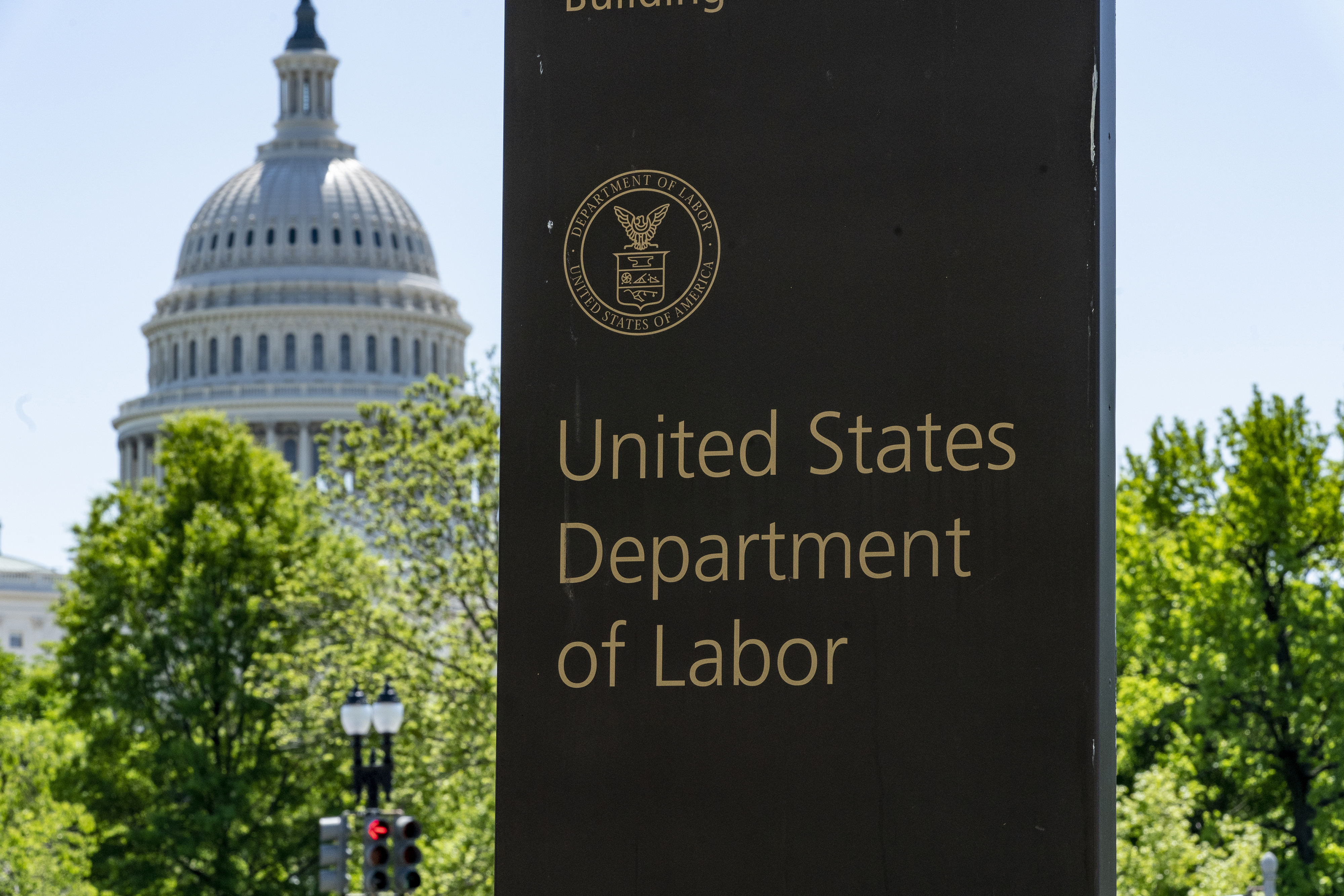 FILE - The entrance to the Labor Department is seen near the Capitol in Washington, May 7, 2020. (AP Photo/J. Scott Applewhite, File)