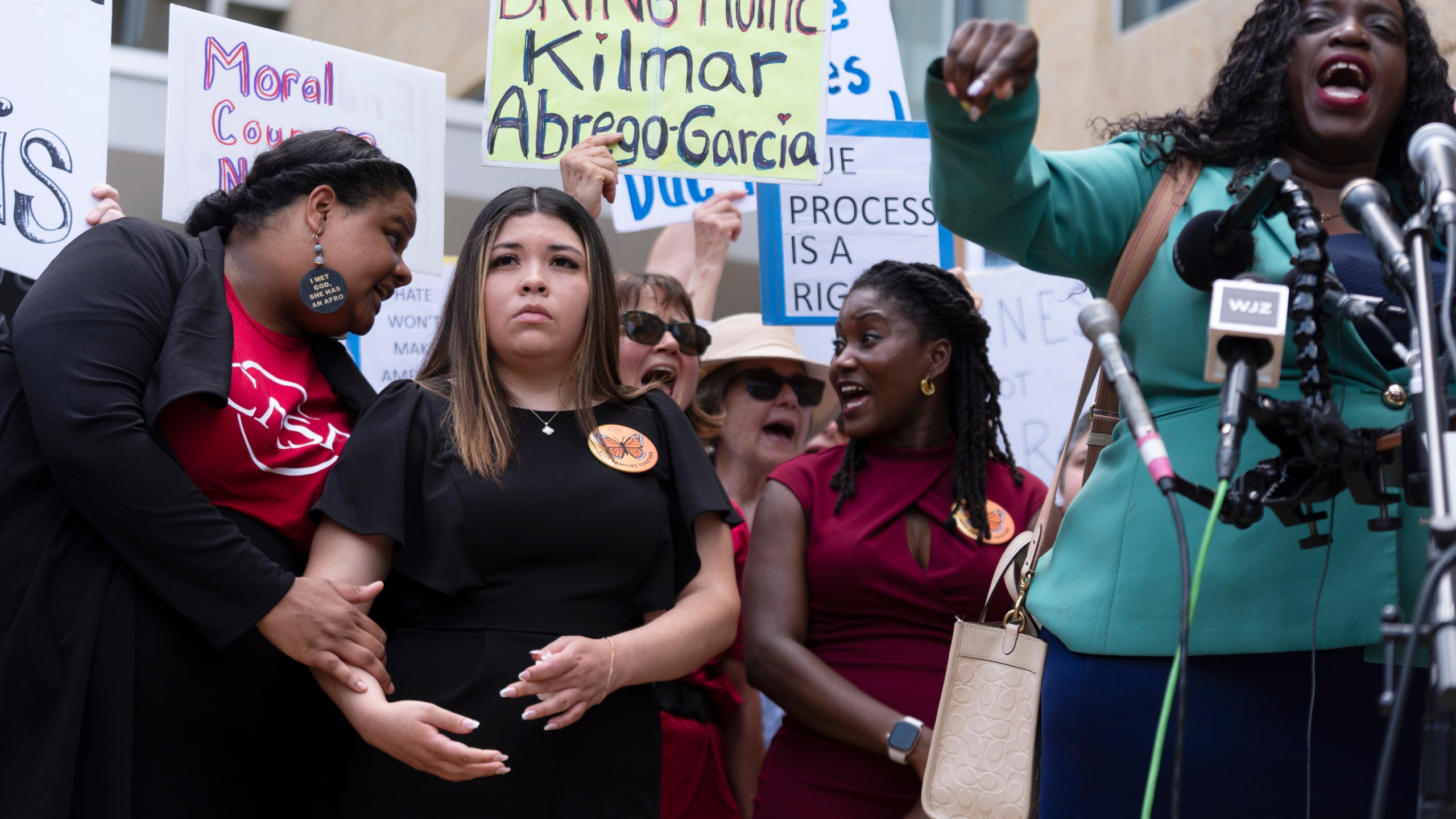 Wife of Kilmar Abrego Garcia, Jennifer Vasquez Sura, second from left, joins a rally outside the U.S. Courthouse in Greenbelt, Md., where a federal judge in Maryland will hear arguments Friday, May 16, 2025. (AP Photo/Manuel Balce Ceneta)