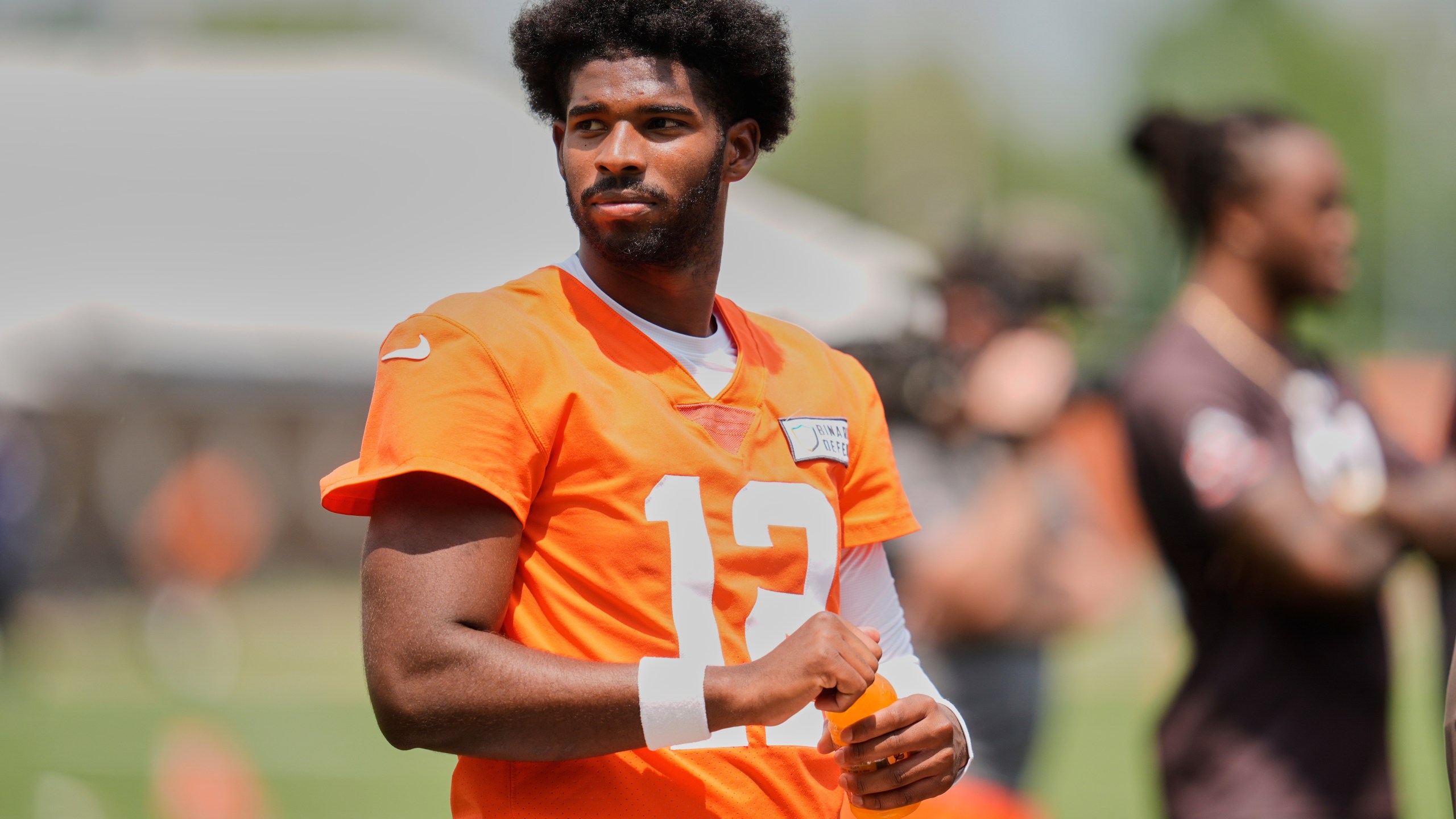 Cleveland Browns quarterback Shedeur Sanders (12) takes a break during NFL football practice in Berea, Ohio, Wednesday, June 4, 2025. (AP Photo/Sue Ogrocki)