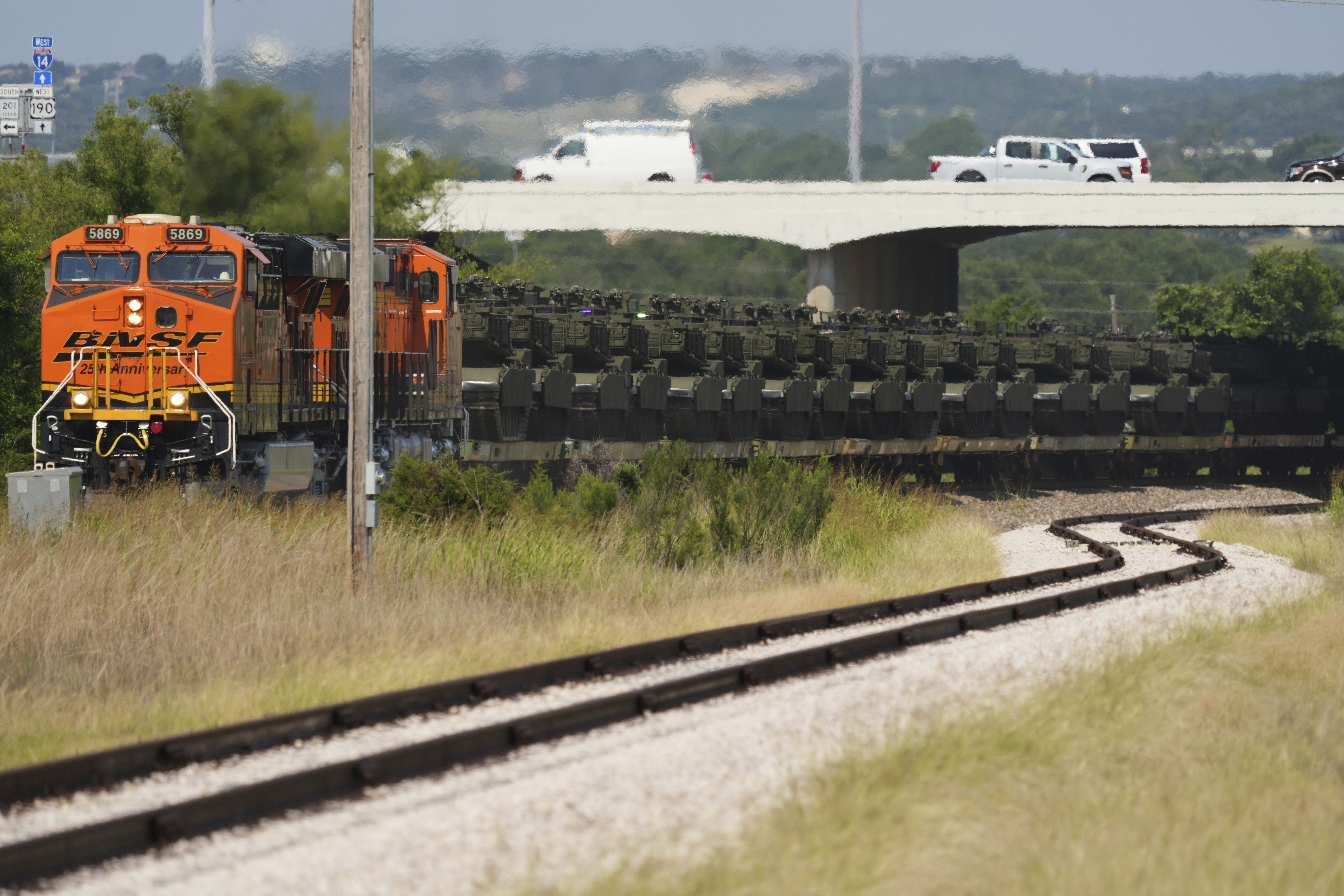 Military tanks and other military vehicles are transported via railroad to Washington, D.C. for an upcoming parade for the Army's 250th anniversary, Monday, June 2, 2025, at Fort Cavazos near Killeen, Texas. (AP Photo/Eric Gay)