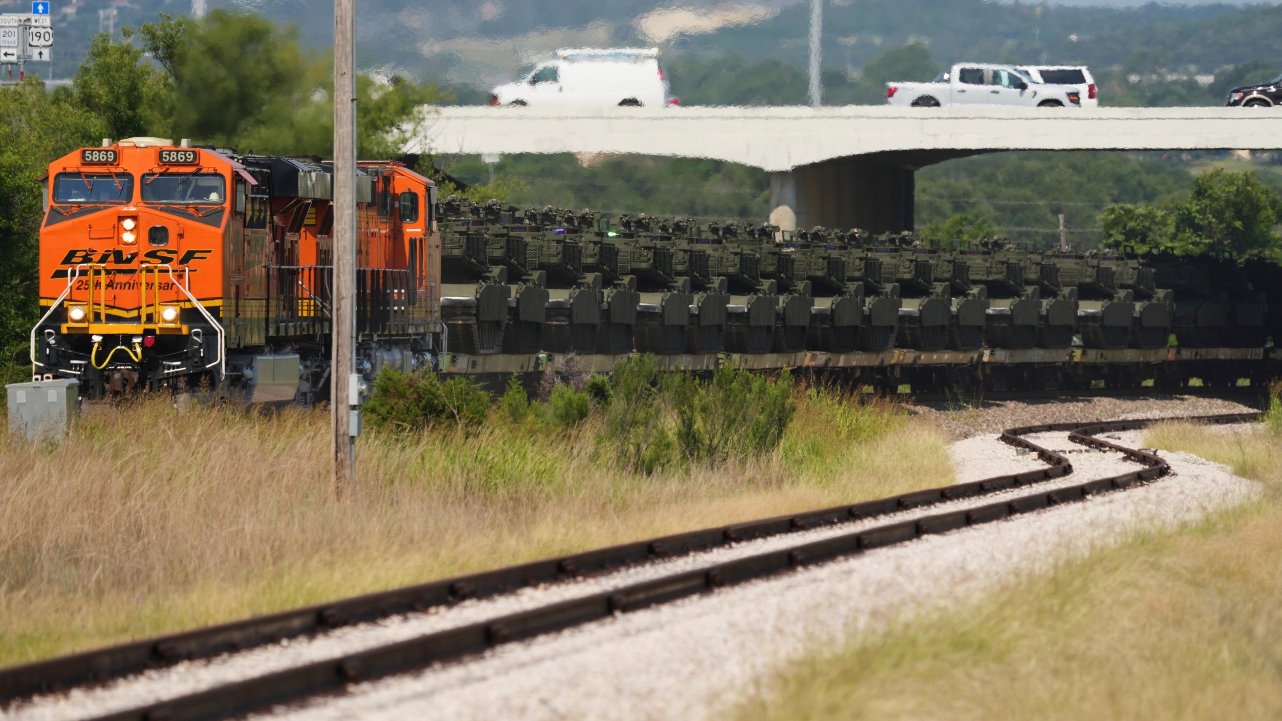 Military tanks and other military vehicles are transported via railroad to Washington, D.C. for an upcoming parade for the Army's 250th anniversary, Monday, June 2, 2025, at Fort Cavazos near Killeen, Texas. (AP Photo/Eric Gay)