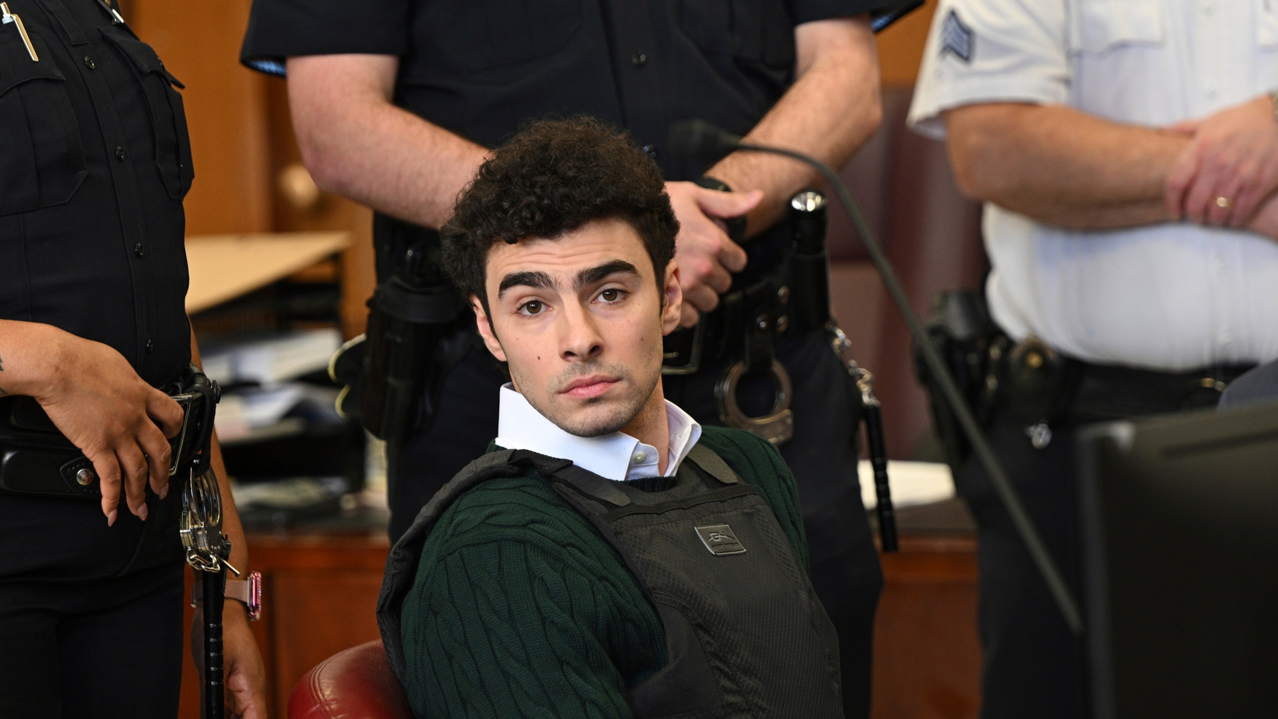 FILE - Luigi Mangione, accused of fatally shooting Brian Thompson, the CEO of UnitedHealthcare, appears in Manhattan state court in New York, Friday, Feb. 21, 2025. (Curtis Means/Pool Photo via AP, File