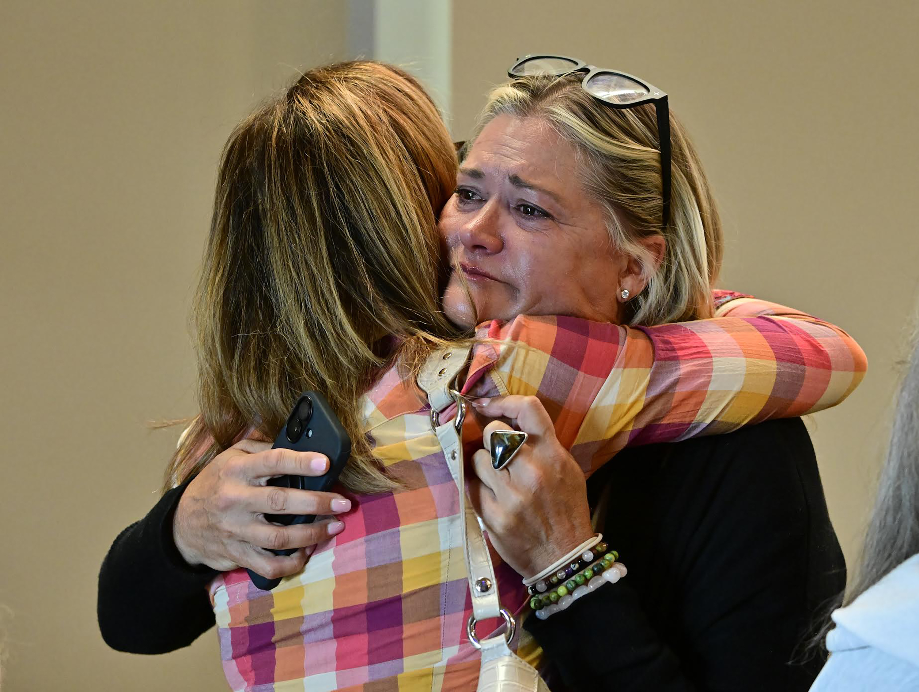 Lesli Colin Johnsen, right, hugs Beth Blacker before a community vigil at the Boulder Jewish Community Center, Wednesday, June 4, 2025, in Boulder, Colo. (Andy Cross/The Denver Post via AP, Pool)