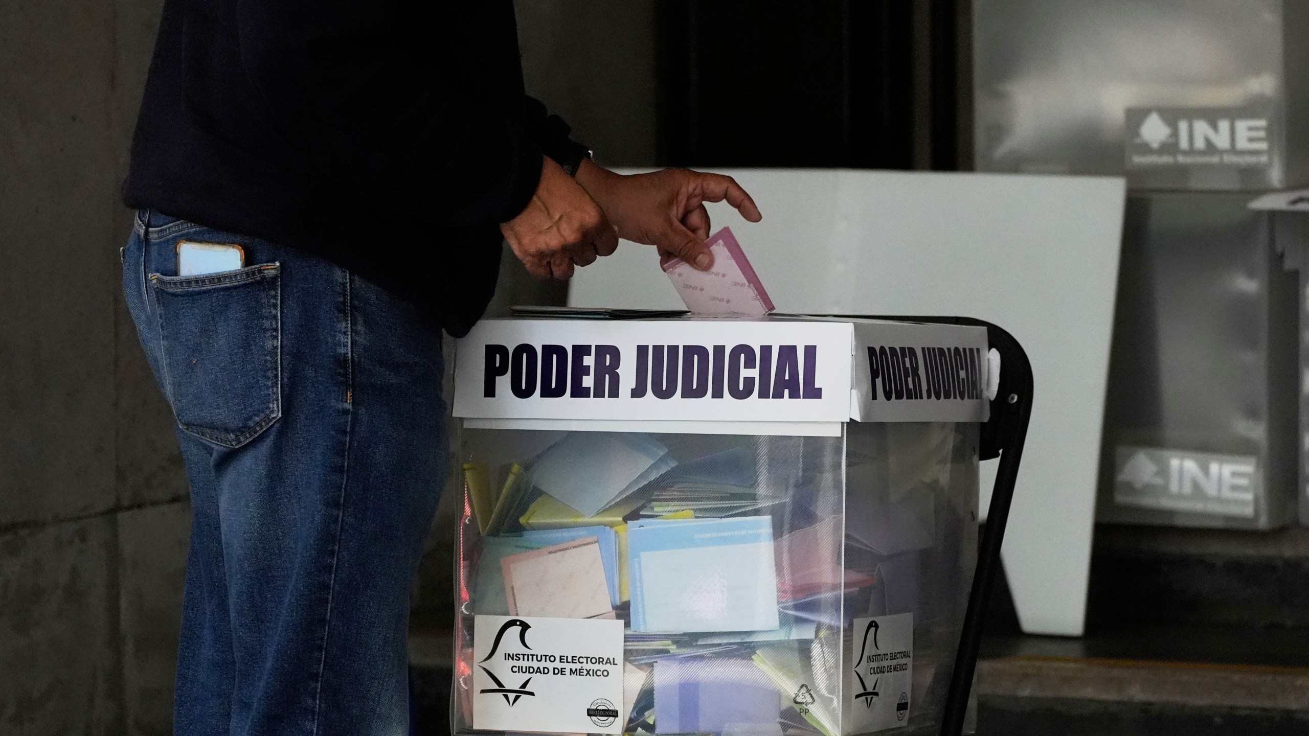 A voter casts their ballot in Mexico's first judicial elections, in Mexico City, Sunday, June 1, 2025. (AP Photo/Marco Ugarte)