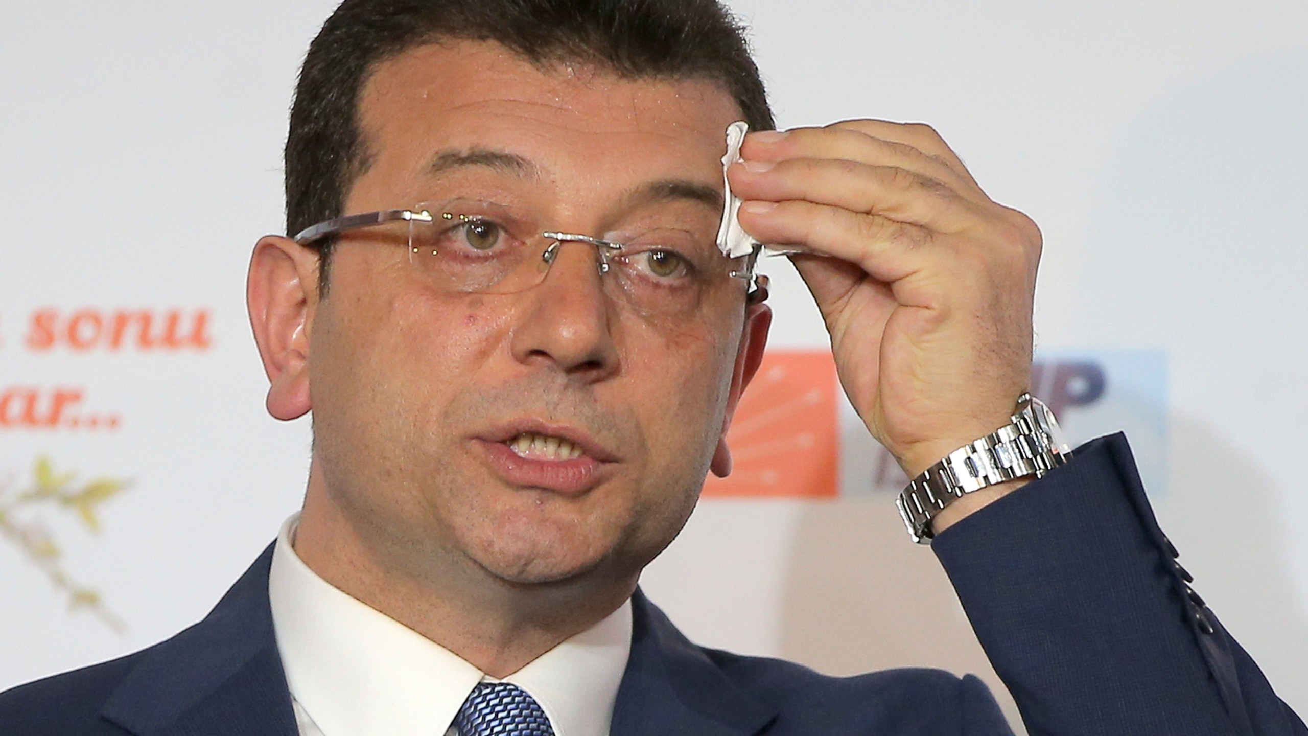 FILE -Ekrem Imamoglu, mayoral candidate for Istanbul of Republican People's Party (CHP) wipes sweat off his forehead during a press conference after the local elections, in Istanbul, March 31, 2019. (AP Photo/File)