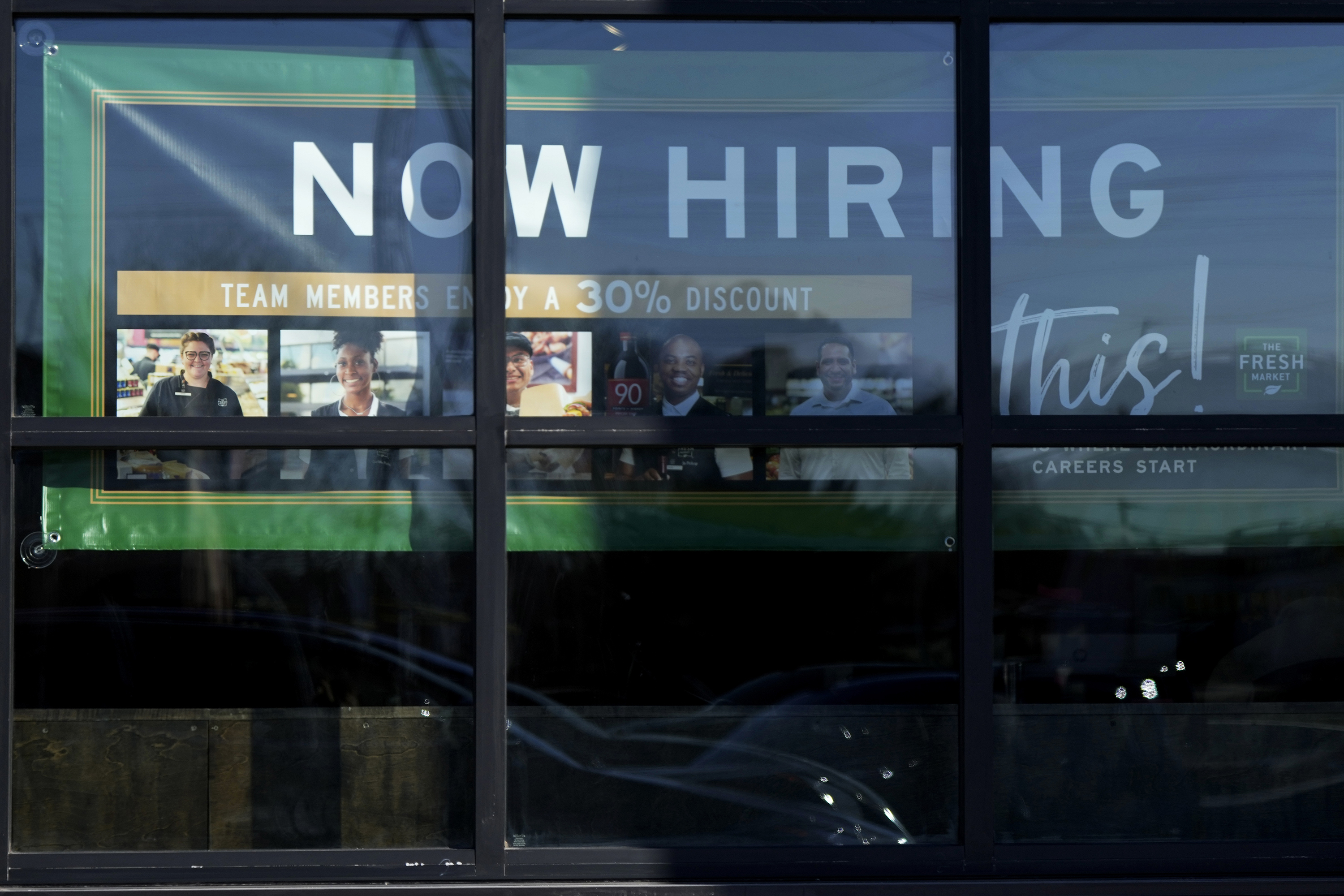 FILE - A hiring sign is displayed at a grocery store in Northbrook, Ill., Tuesday, Jan. 21, 2025. (AP Photo/Nam Y. Huh)