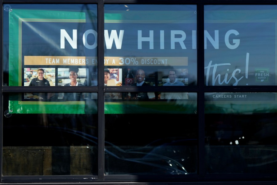 FILE - A hiring sign is displayed at a grocery store in Northbrook, Ill., Tuesday, Jan. 21, 2025. (AP Photo/Nam Y. Huh)