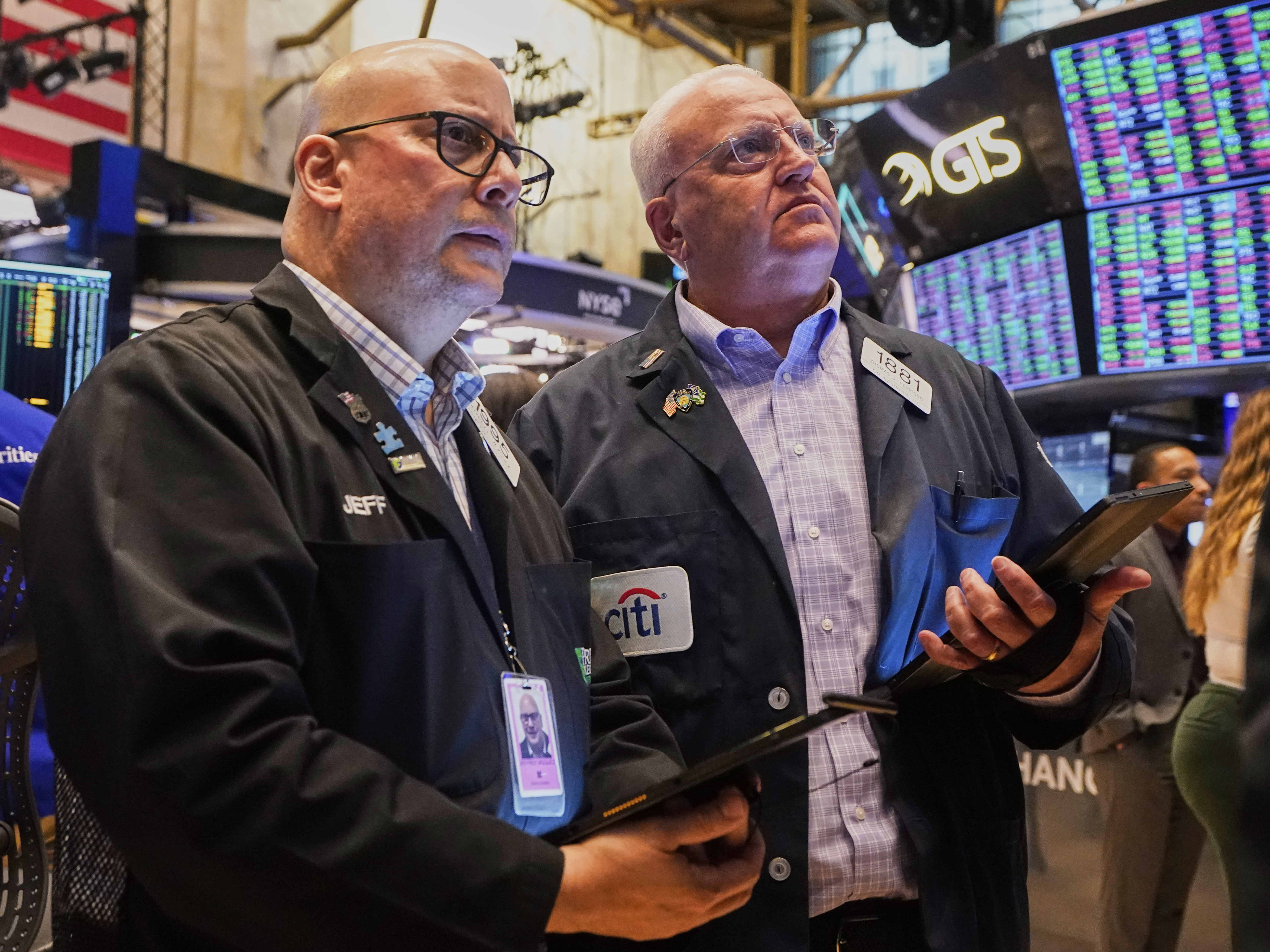 Traders Jeffrey Vazquez, left, and Thomas Ferrigno work on the floor of the New York Stock Exchange, Thursday, June 5, 2025. (AP Photo/Richard Drew)