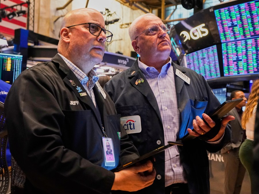 Traders Jeffrey Vazquez, left, and Thomas Ferrigno work on the floor of the New York Stock Exchange, Thursday, June 5, 2025. (AP Photo/Richard Drew)