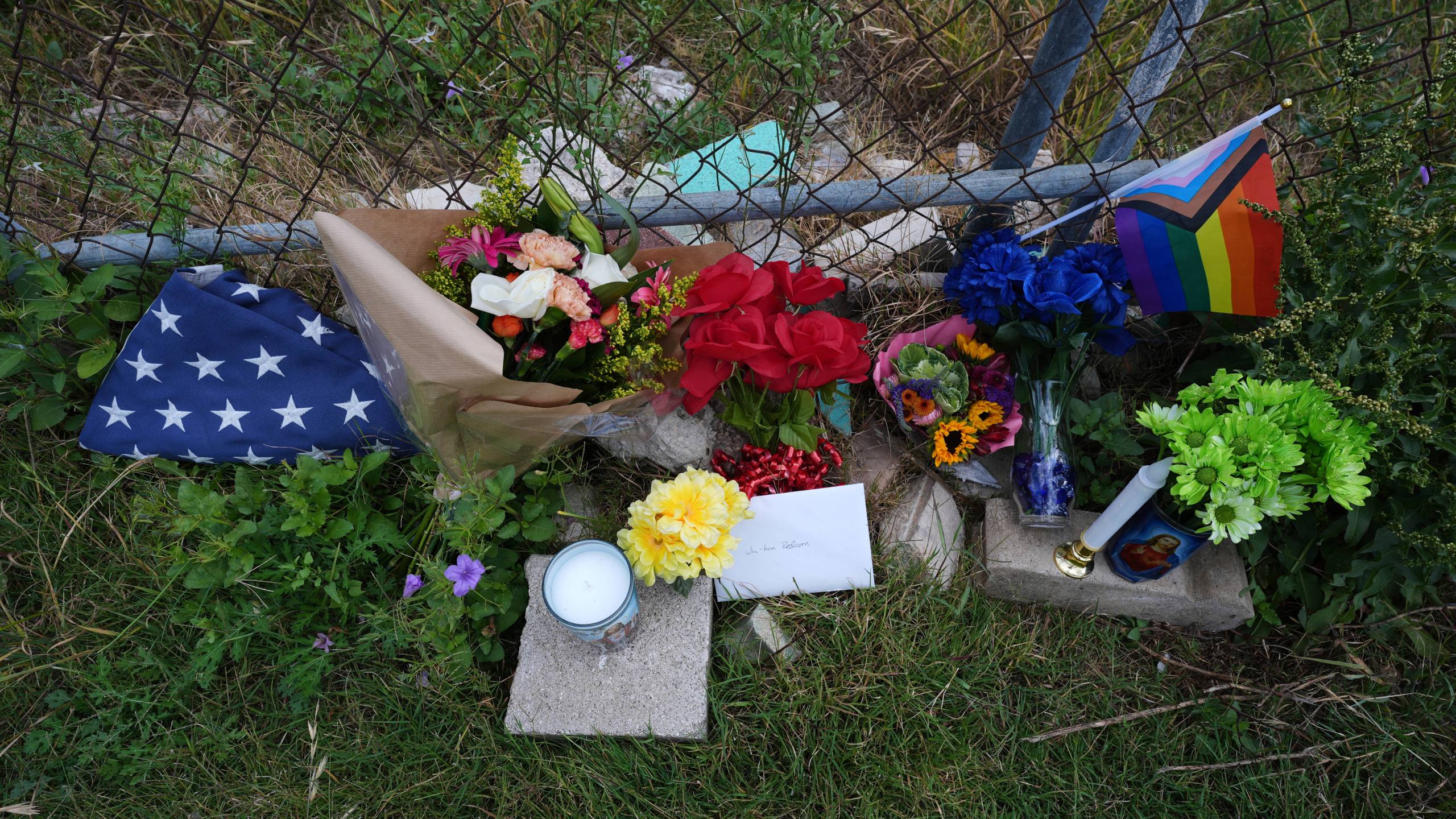 Candles, flowers, and notes make up make-shift memorial for voice actor Jonathan Joss who was recently killed, Tuesday, June 3, 2025, in San Antonio. (AP Photo/Eric Gay)