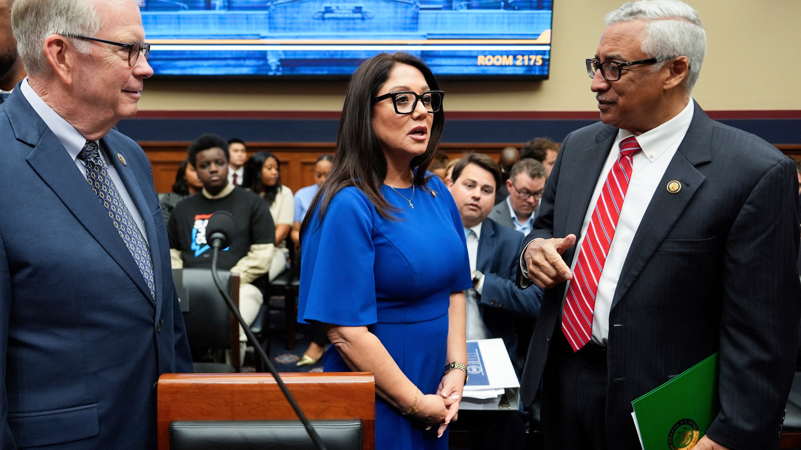 Secretary of Labor Lori Chavez-DeRemer speaks with Rep. Tim Walberg, R-Mich., left, and Rep. Bobby Scott, D-Va., right, before a House Education and Workforce hearing, Thursday, June 5, 2025, on Capitol Hill in Washington. (AP Photo/Julia Demaree Nikhinson)