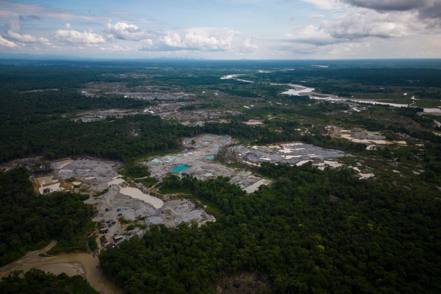 FILE - Visible deforestation from illegal mining surrounds the Quito River, near Paimado, Colombia, Sept. 23, 2024. (AP Photo/Ivan Valencia, File)