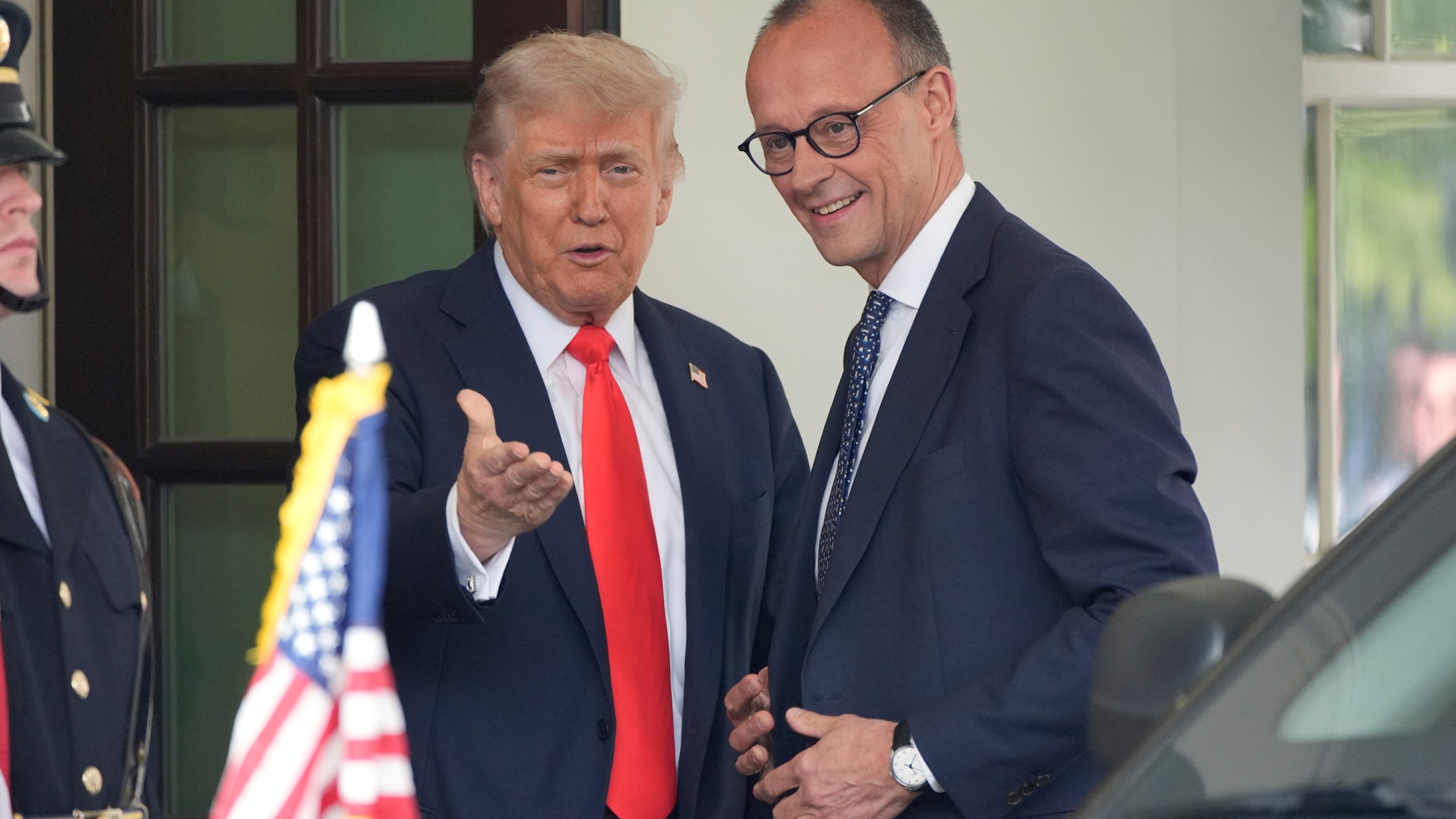 President Donald Trump, left, greets Germany's Chancellor Friedrich Merz upon his arrival at the White House, Thursday, June 5, 2025, in Washington. (AP Photo/Alex Brandon)