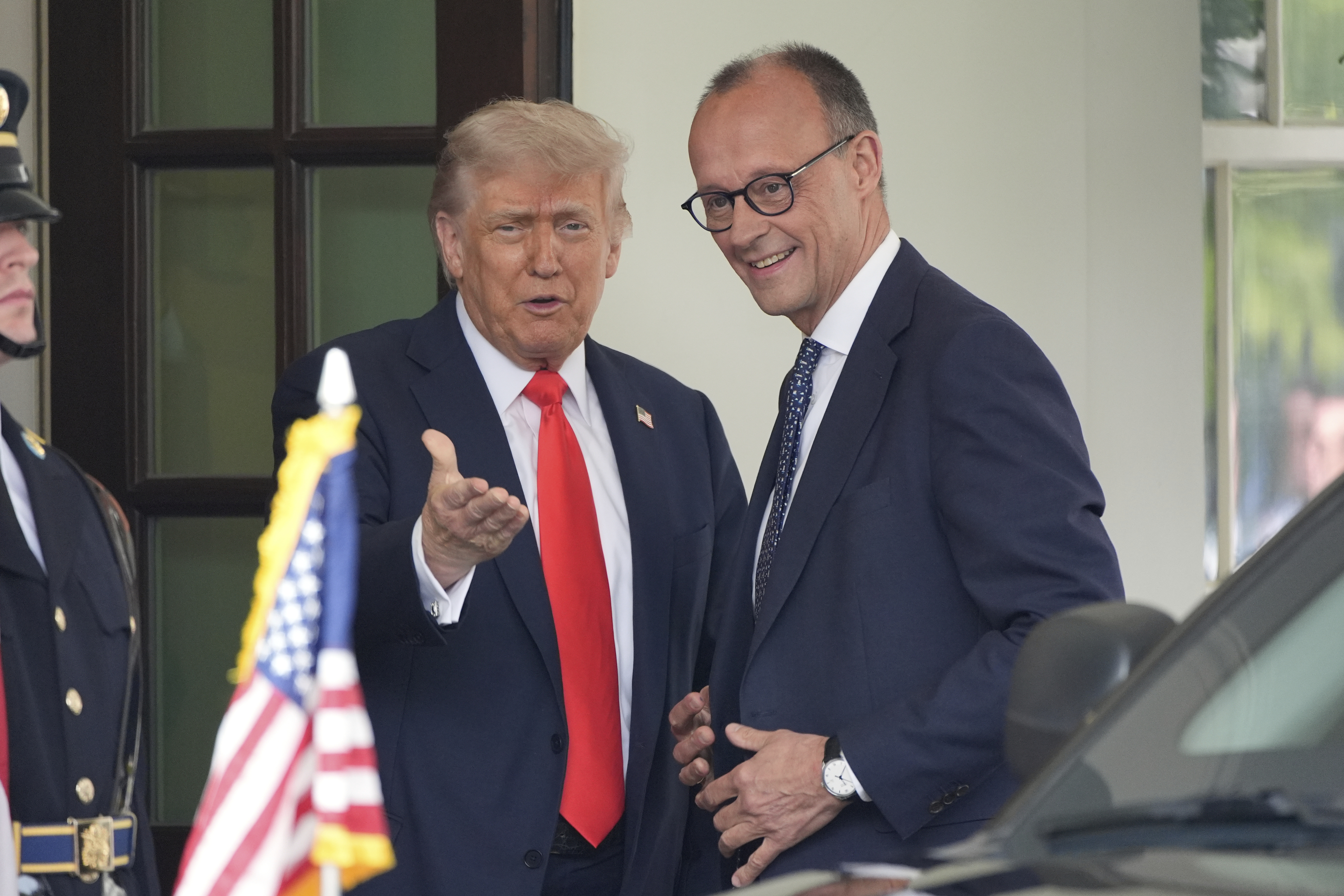 President Donald Trump, left, greets Germany's Chancellor Friedrich Merz upon his arrival at the White House, Thursday, June 5, 2025, in Washington. (AP Photo/Alex Brandon)