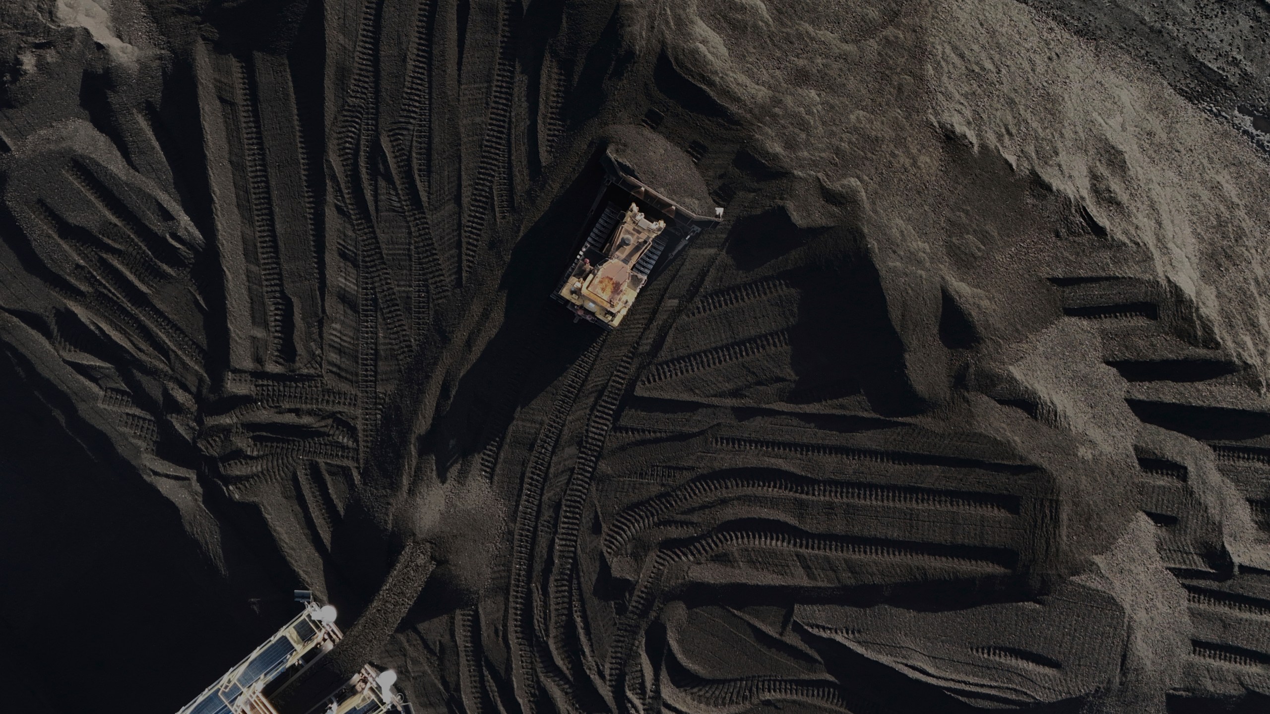 A bulldozer moves coal Thursday, April 10, 2025, in Princeton, Ind. (AP Photo/Joshua A. Bickel)