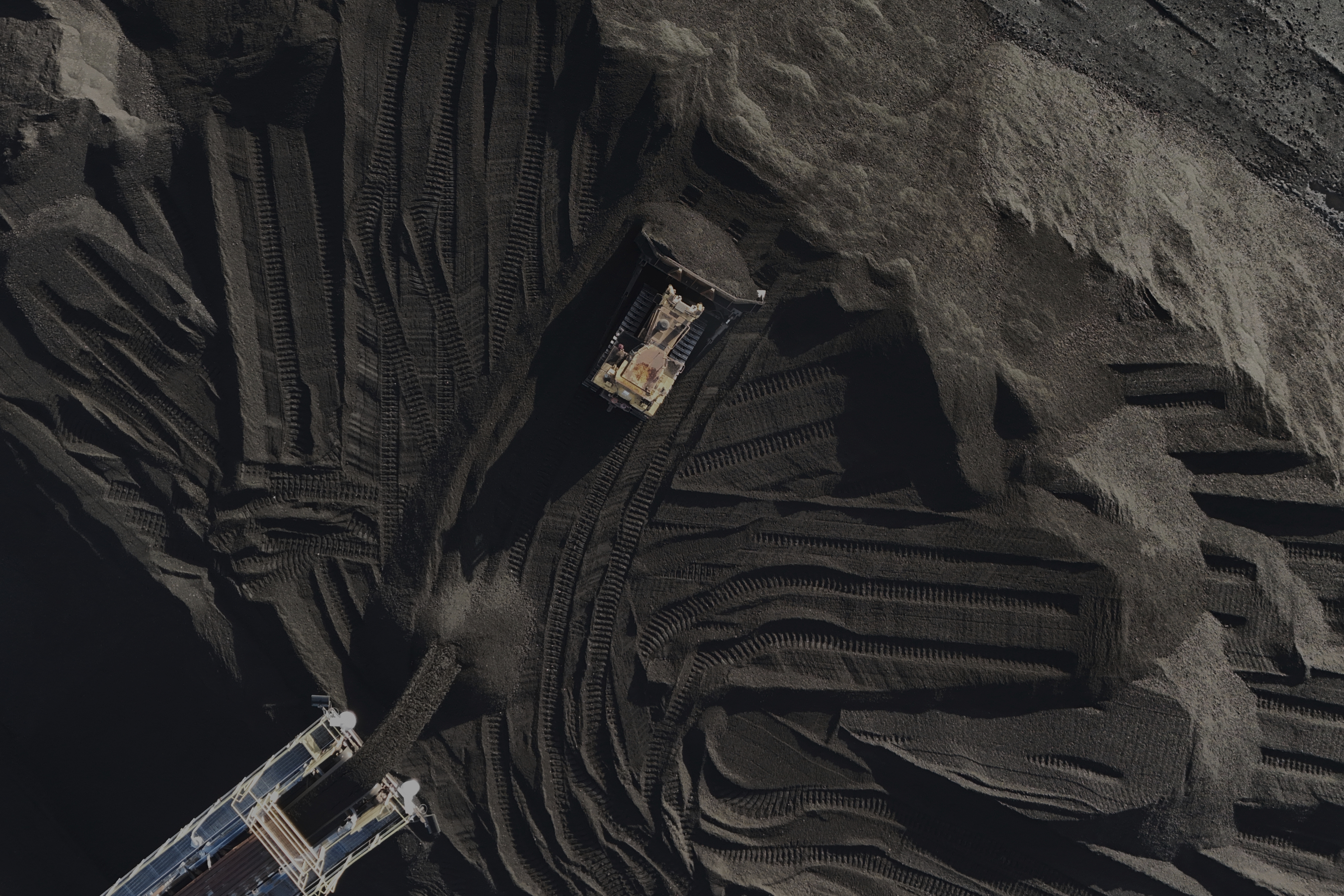 A bulldozer moves coal Thursday, April 10, 2025, in Princeton, Ind. (AP Photo/Joshua A. Bickel)