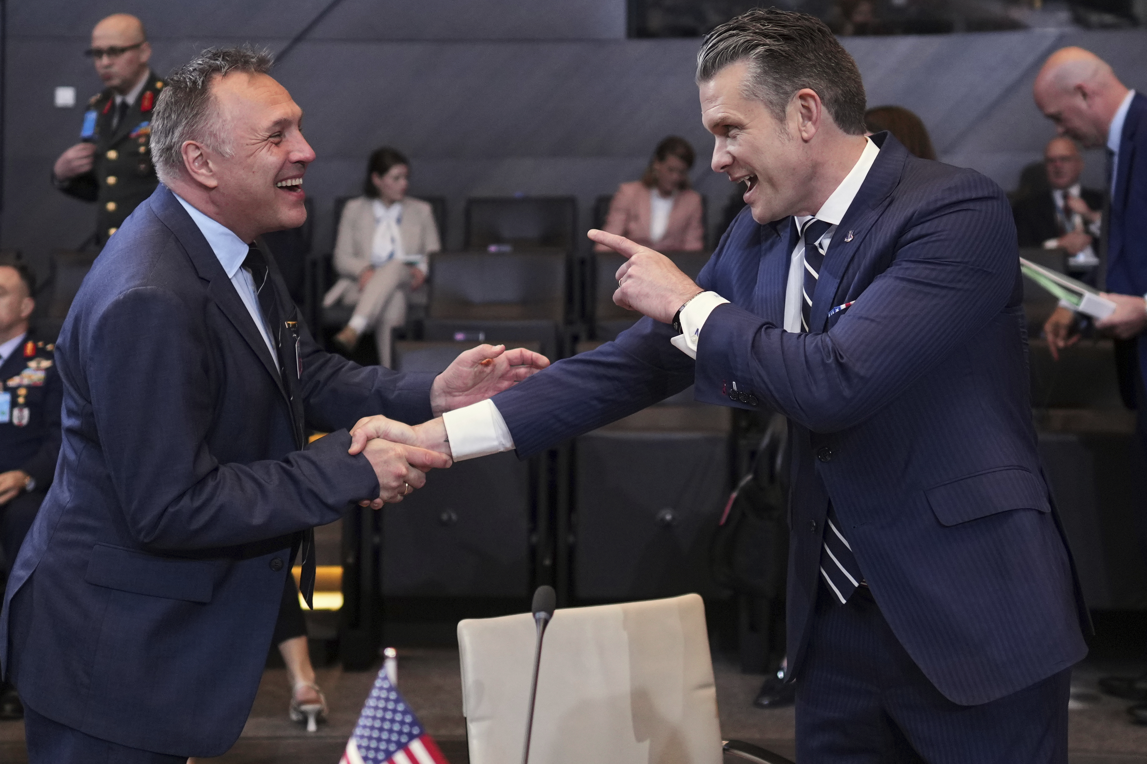 Defense Secretary Pete Hegseth, right, speaks with Norway's Defense Minister Tore Sandvik during a meeting of NATO defense ministers at NATO headquarters in Brussels, Thursday, June 5, 2025. (AP Photo/Virginia Mayo)