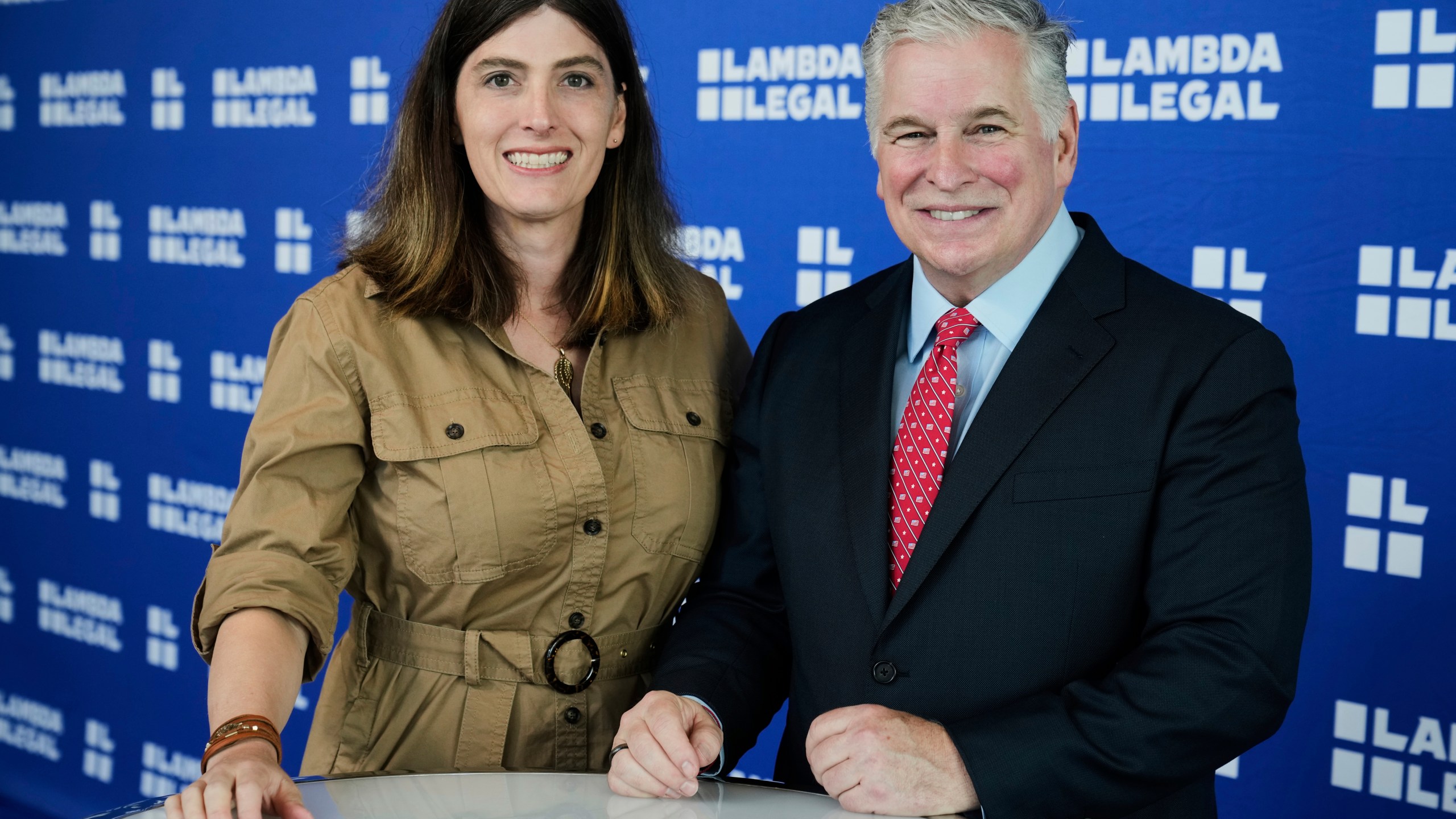 U.S. Navy Commander Emily Shilling, left, and Lambda Legal CEO Kevin Jennings pose for a photo before the Liberty Awards National Dinner, in New York, Thursday, June 5, 2025. (AP Photo/Richard Drew)