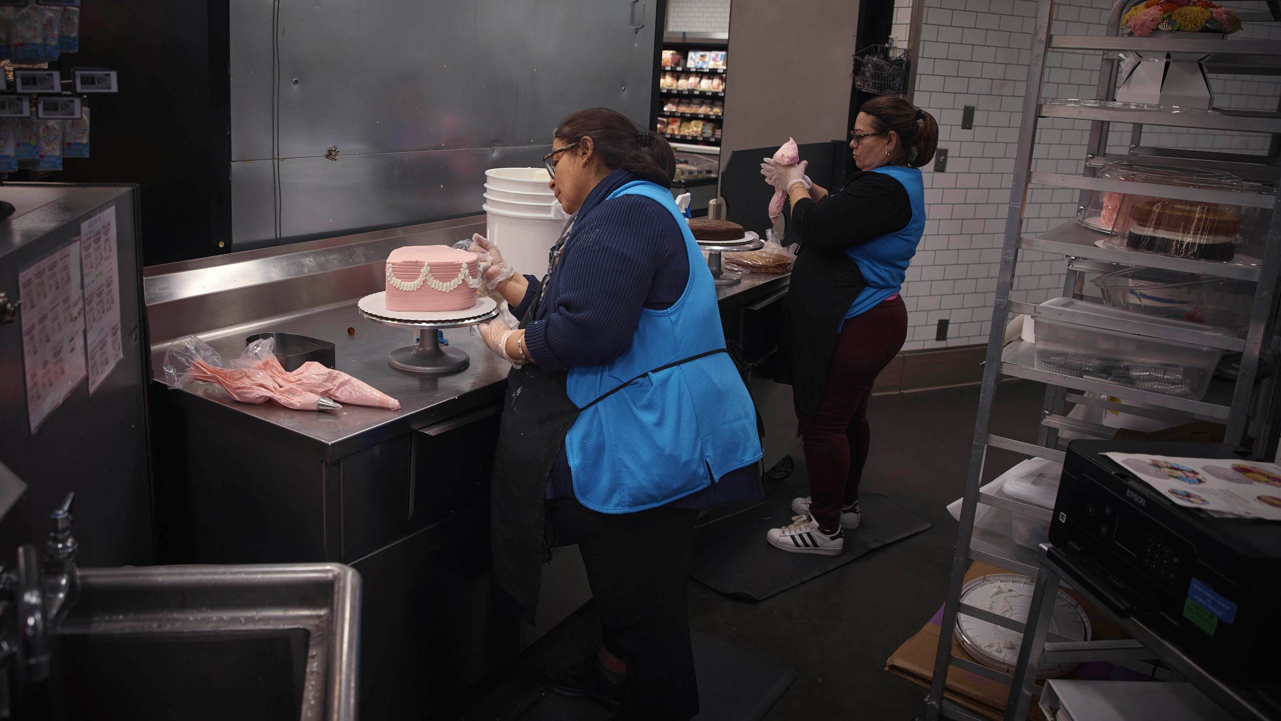 Employees make cakes inside Walmart Supercenter on Wednesday, May 28, 2025, in North Bergen, N.J. (AP Photo/Andres Kudacki)