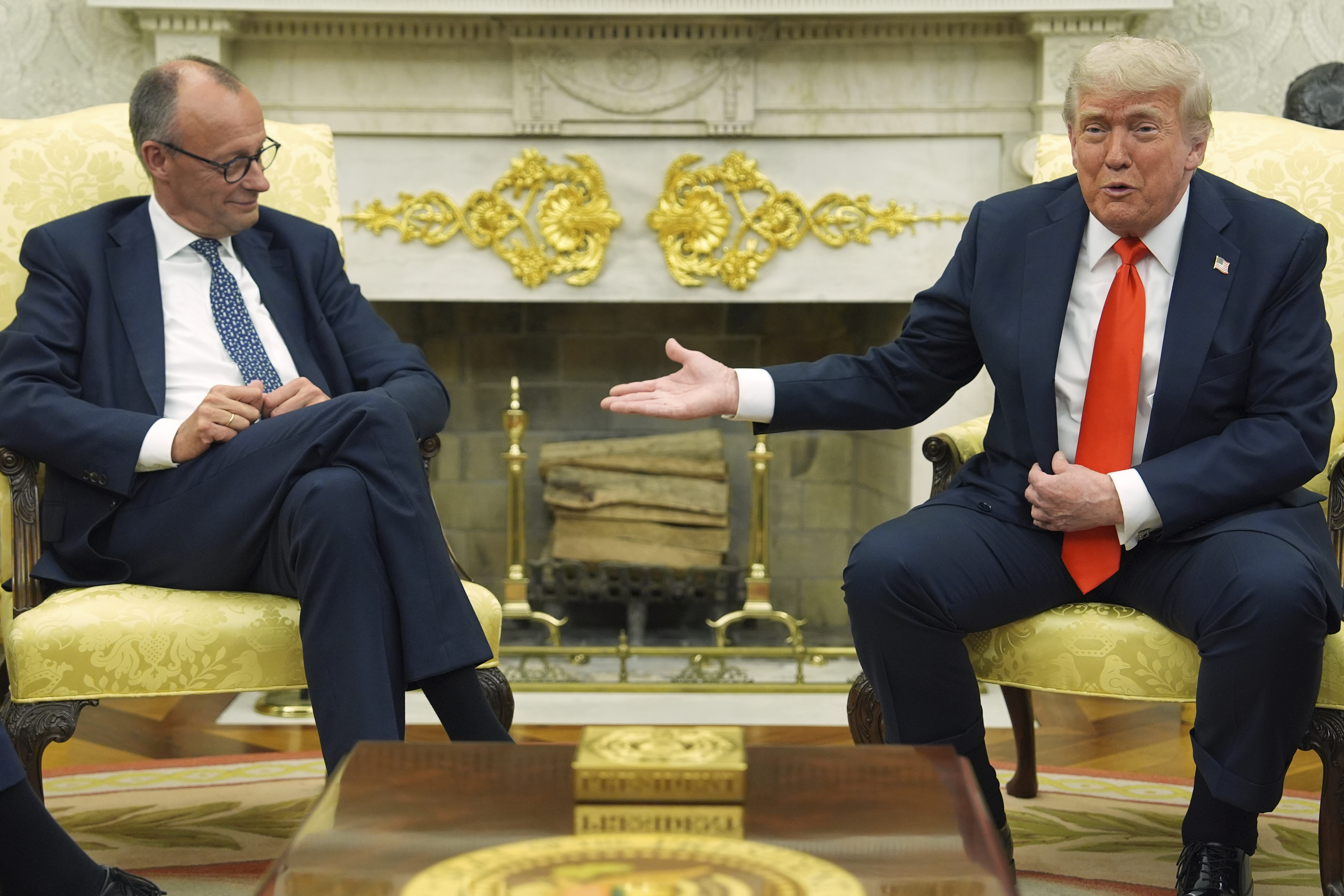 President Donald Trump, right, meets Germany's Chancellor Friedrich Merz in the Oval Office of the White House, Thursday, June 5, 2025, in Washington. (AP Photo/Evan Vucci)
