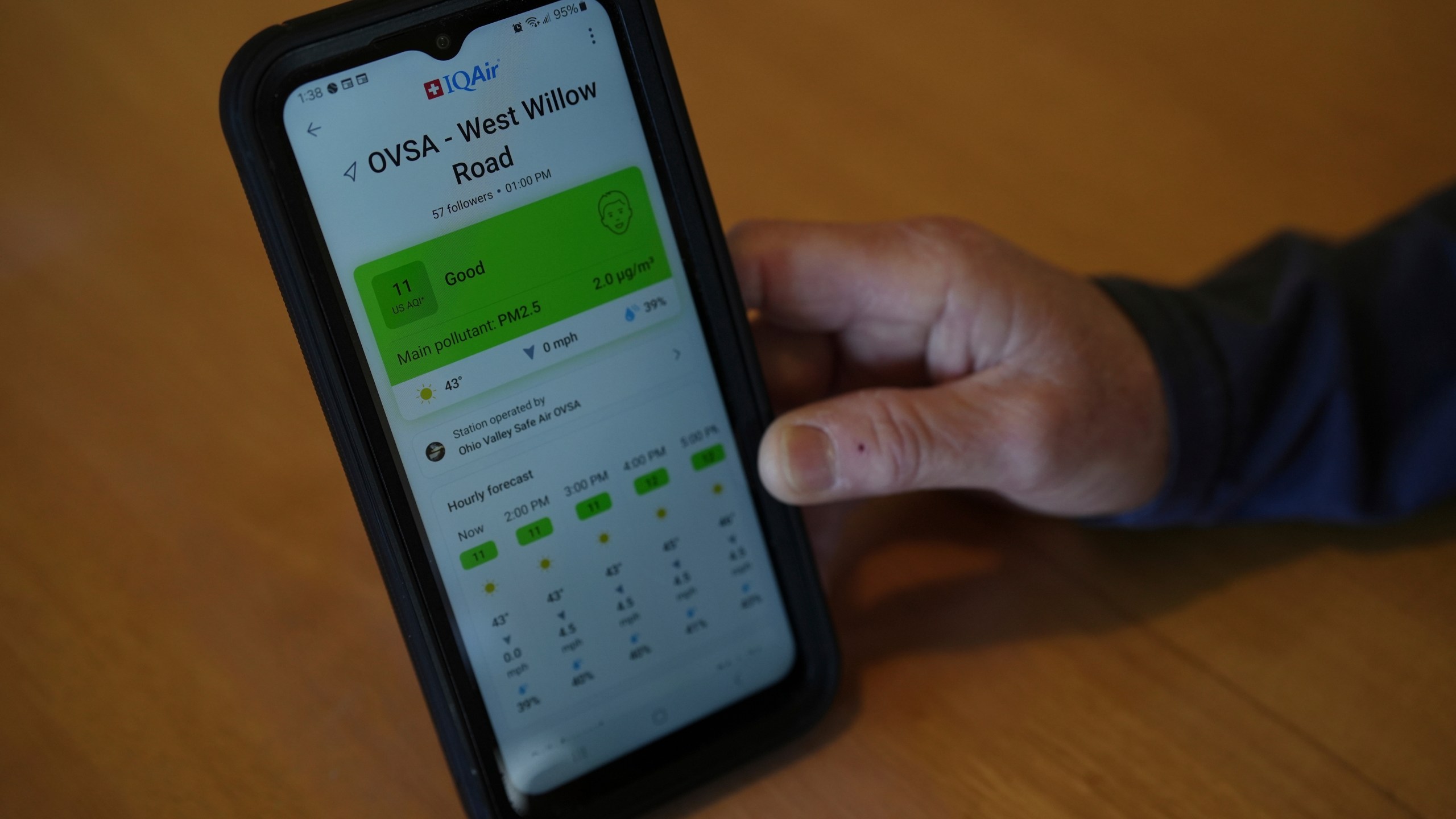 Mary Hess displays air quality data on the IQAir app on her phone Tuesday, April 8, 2025, in Dale, Ind. (AP Photo/Joshua A. Bickel)
