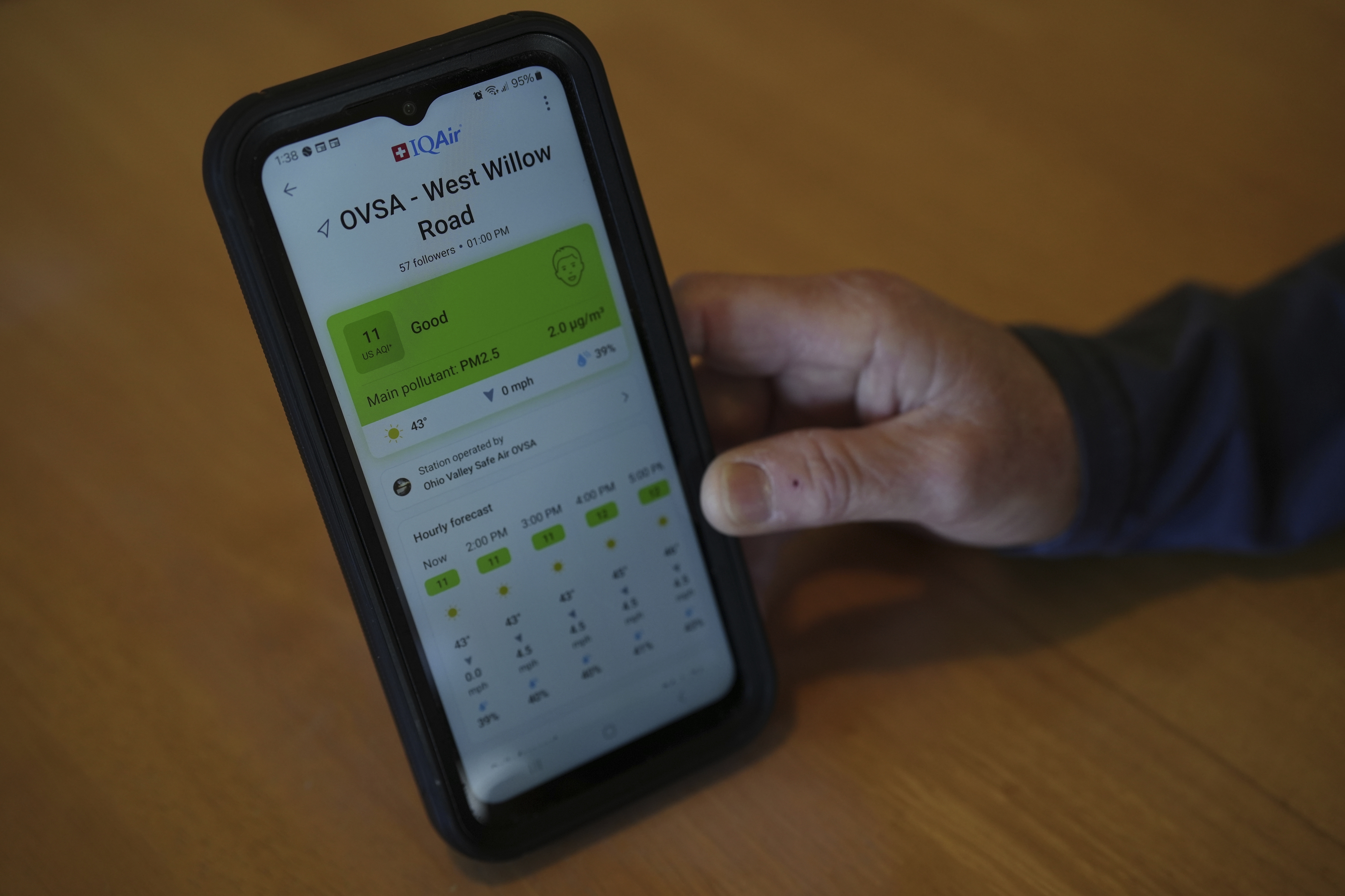 Mary Hess displays air quality data on the IQAir app on her phone Tuesday, April 8, 2025, in Dale, Ind. (AP Photo/Joshua A. Bickel)