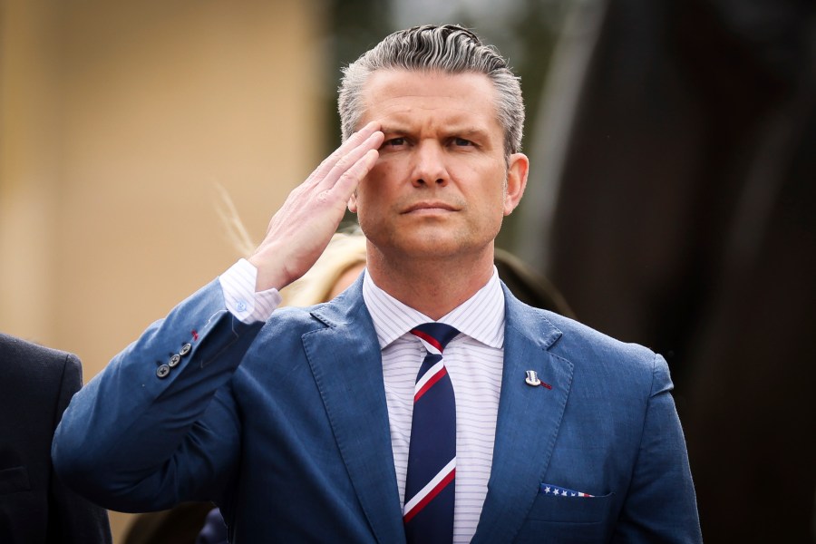 U.S. Defense Secretary Pete Hegseth salutes during a ceremony at the US cemetery to commemorate the 81st anniversary of the D-Day landings, Friday, June 6, 2025 in Colleville-sur-Mer, Normandy. (AP Photo/Thomas Padilla)