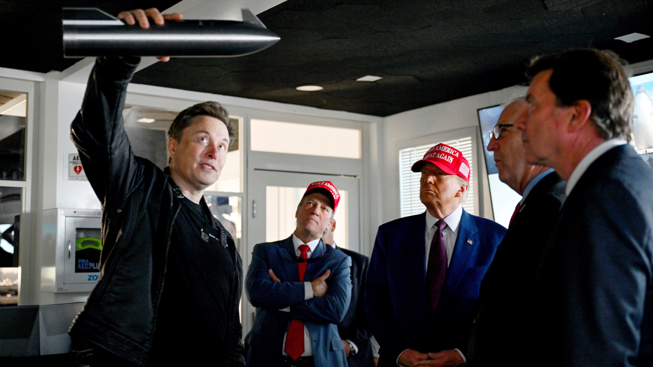 FILE - President-elect Donald Trump listens as Elon Musk explains the operations ahead of the launch of the sixth test flight of the SpaceX Starship rocket, Nov. 19, 2024, in Boca Chica, Texas. (Brandon Bell/Pool via AP, File)