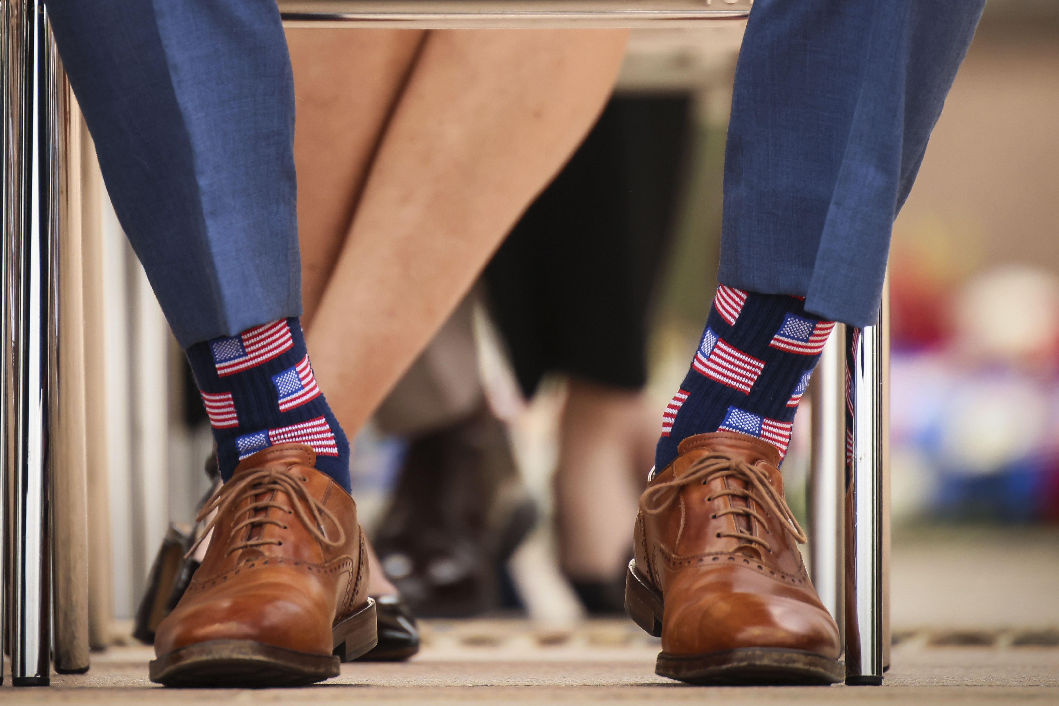 U.S. Defense Secretary Pete Hegseth wears socks showing the American flag during a ceremony at the US cemetery to commemorate the 81st anniversary of the D-Day landings, Friday, June 6, 2025 in Colleville-sur-Mer, Normandy. (AP Photo/Thomas Padilla)