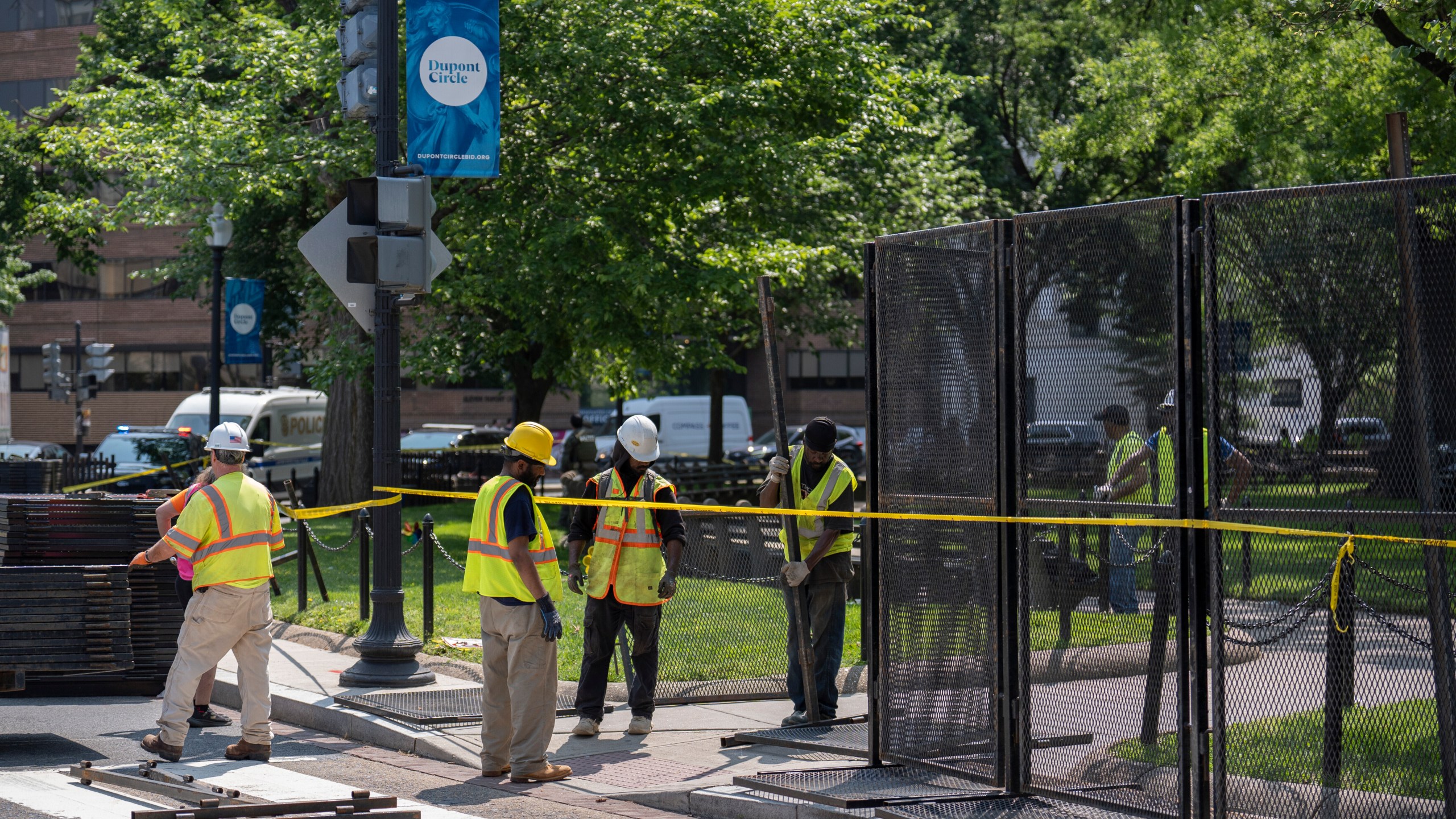 Workers put up fencing around Dupont Circle ahead of the World Pride Parade, Friday, June 6, 2025, in Washington. (AP Photo/Mark Schiefelbein)