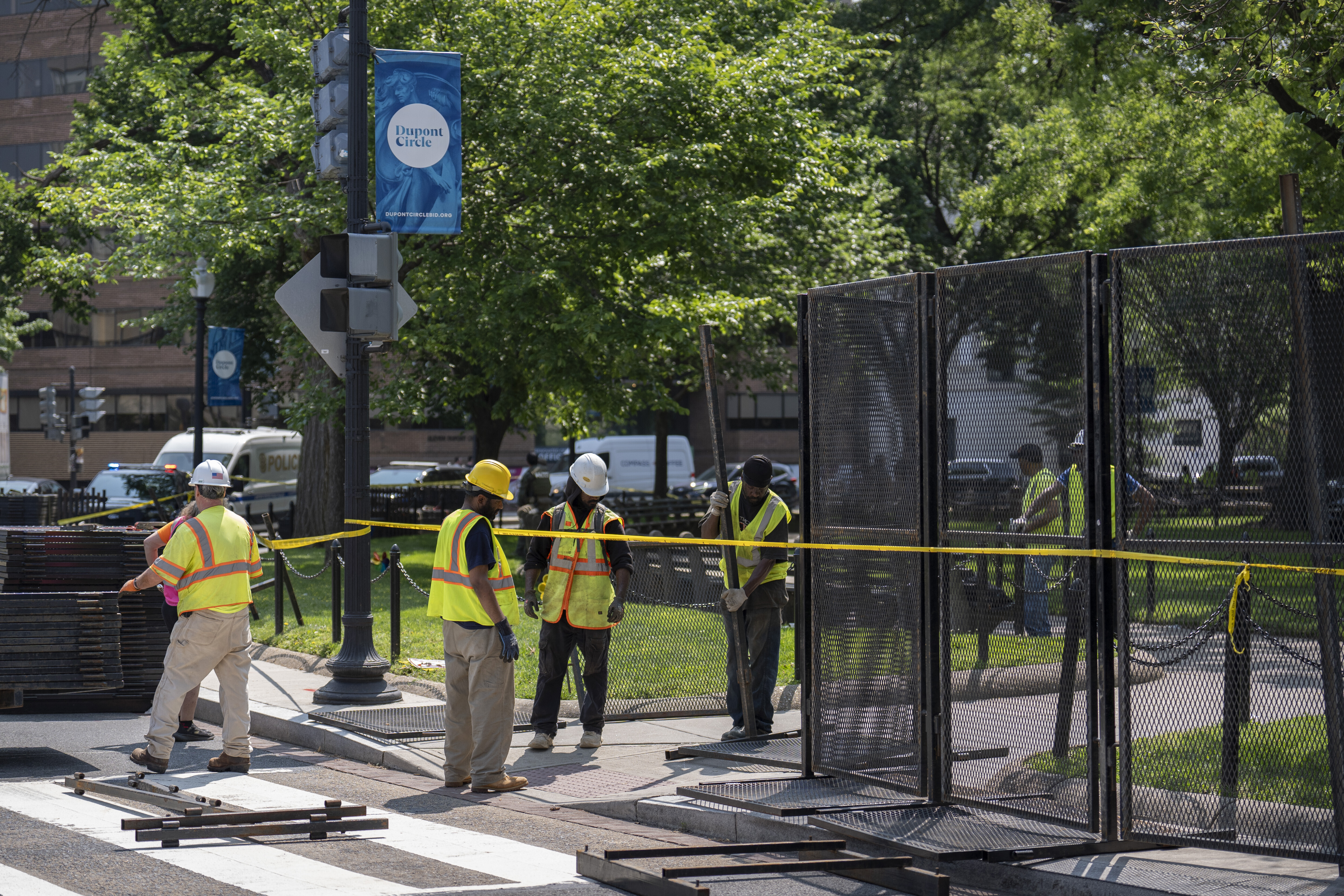 Workers put up fencing around Dupont Circle ahead of the World Pride Parade, Friday, June 6, 2025, in Washington. (AP Photo/Mark Schiefelbein)