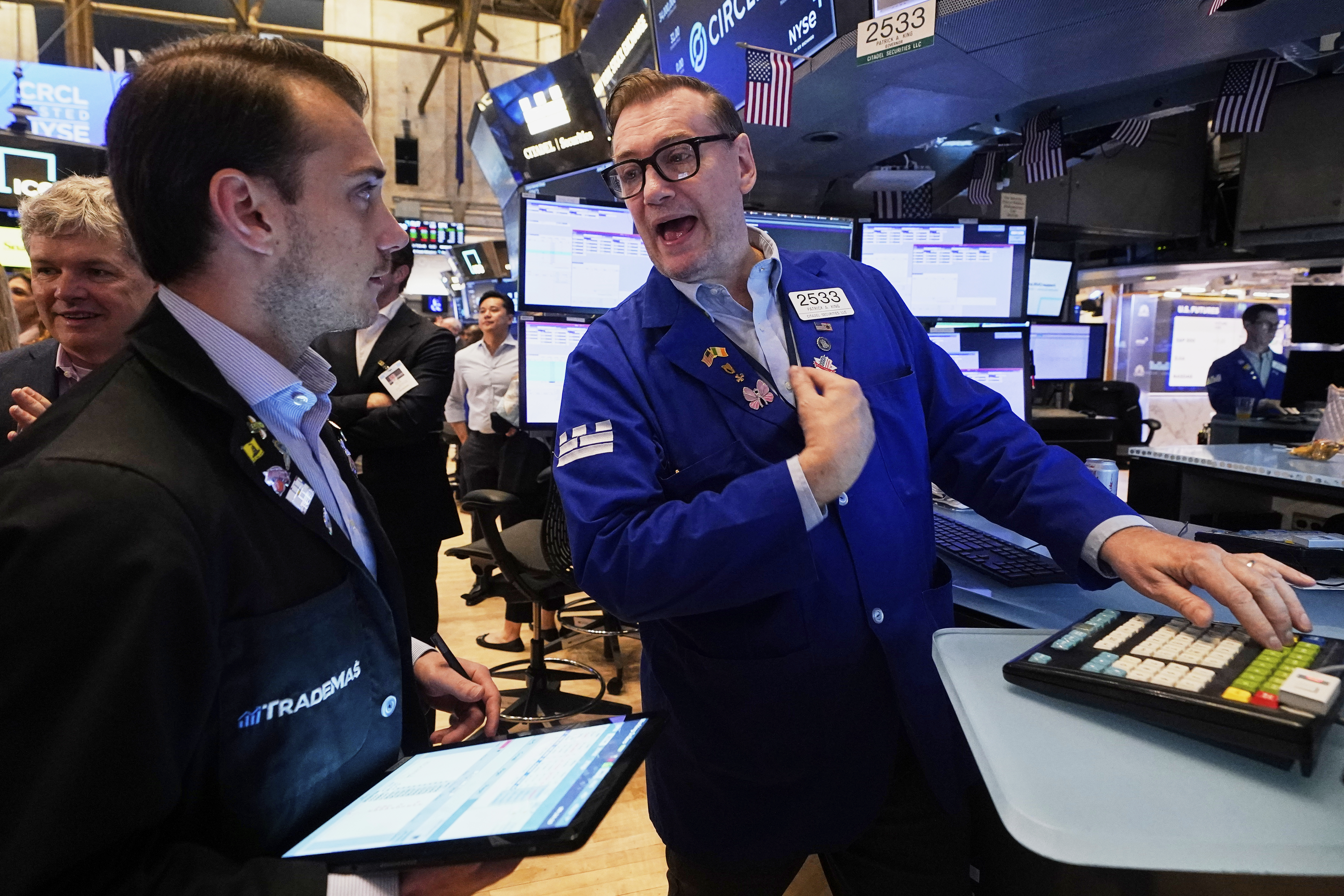 Trader Dylan Halvorsan, left, and specialist Patrick King work on the floor of the New York Stock Exchange, Thursday, June 5, 2025. (AP Photo/Richard Drew)