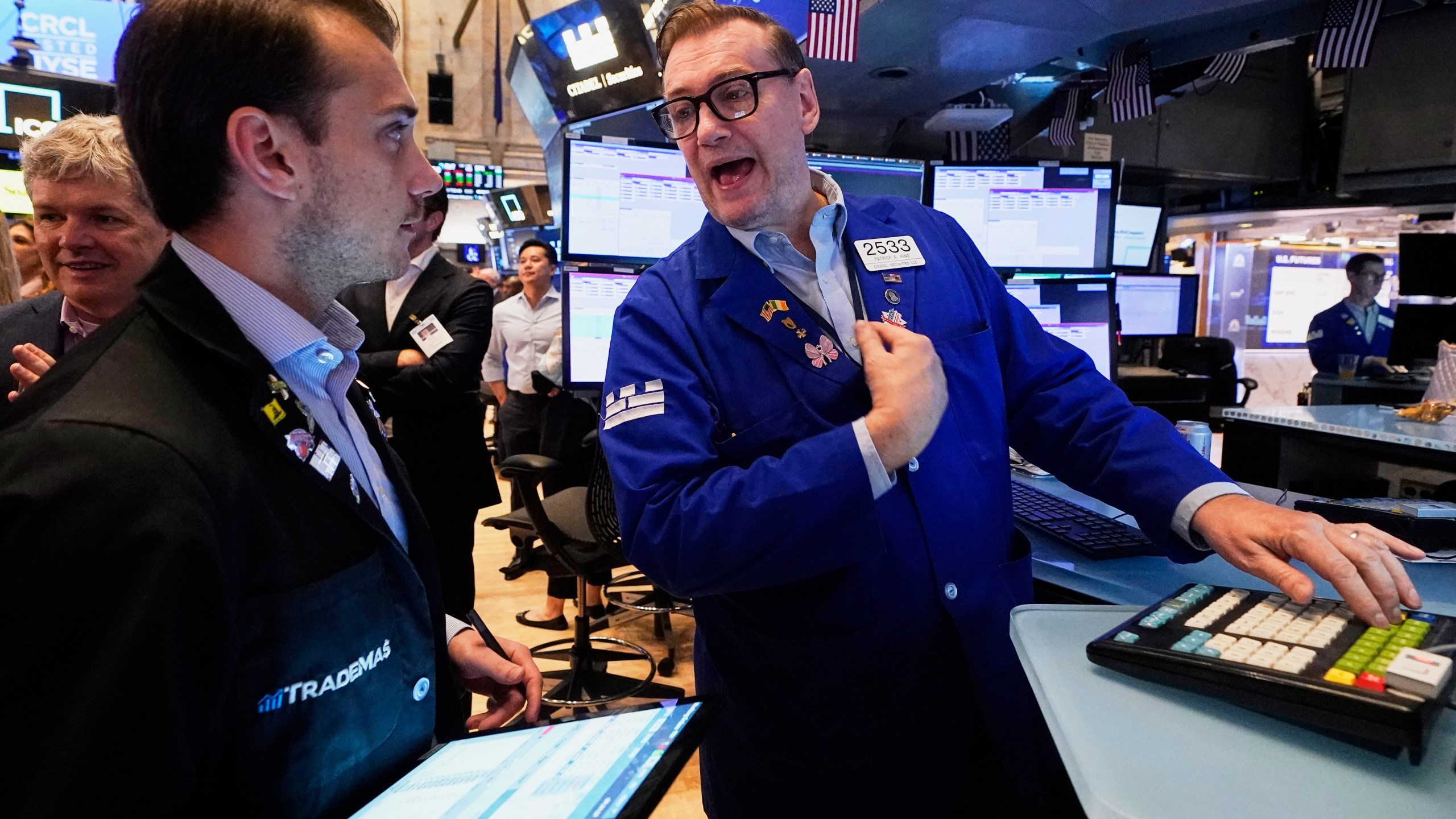 Trader Dylan Halvorsan, left, and specialist Patrick King work on the floor of the New York Stock Exchange, Thursday, June 5, 2025. (AP Photo/Richard Drew)