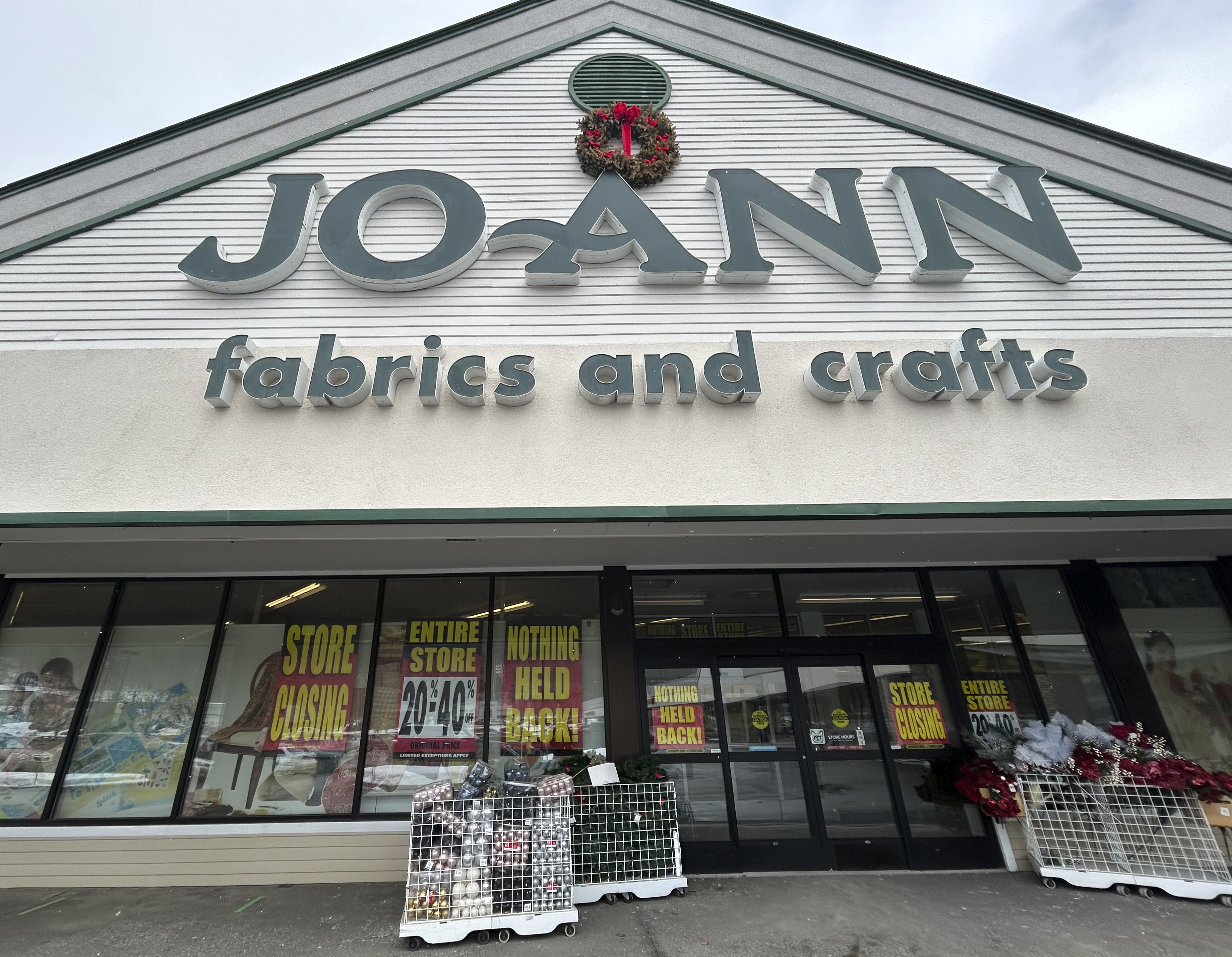 Store closing signs appear in the window at a Joann Fabric and Crafts store in Barre, Vt., on Saturday, March 8, 2025. (AP Photo/Carolyn Lessard)