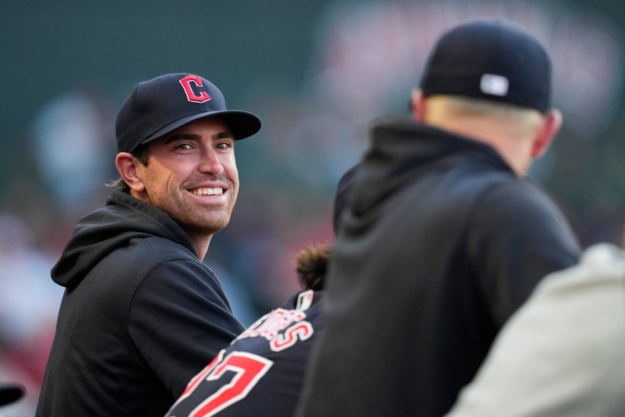 FILE - Cleveland Guardians' Shane Bieber stands in the dugout during the third inning of a baseball game against the Los Angeles Angels in Anaheim, Calif., May 25, 2024. (AP Photo/Ashley Landis, file)