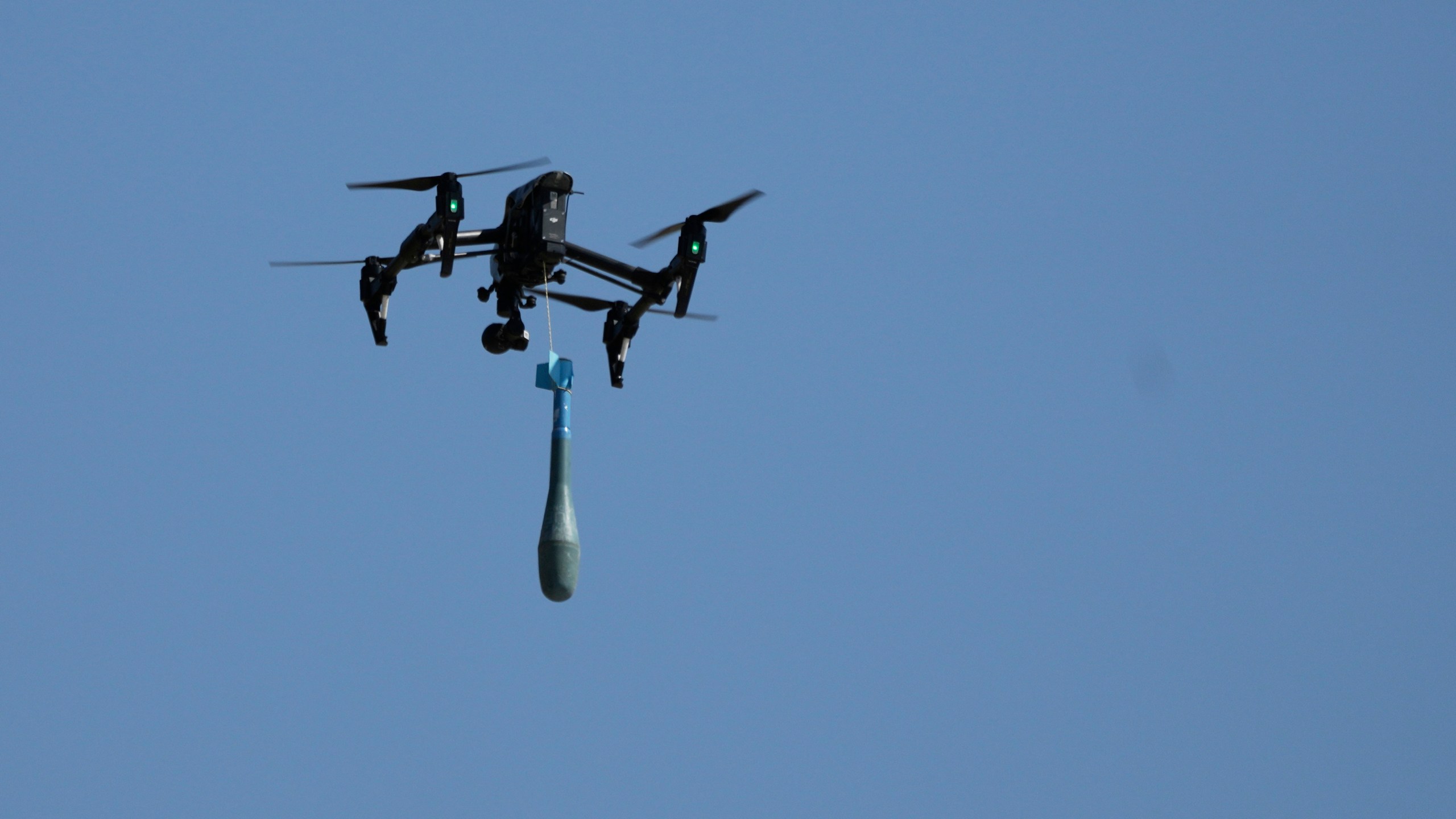 FILE - A drone carries a mortar shell as soldiers take part in the U.S.-led Immediate Response 25 military exercise in Petrochori, Greece, Wednesday, June 4, 2025. (AP Photo/Thanassis Stavrakis, File)