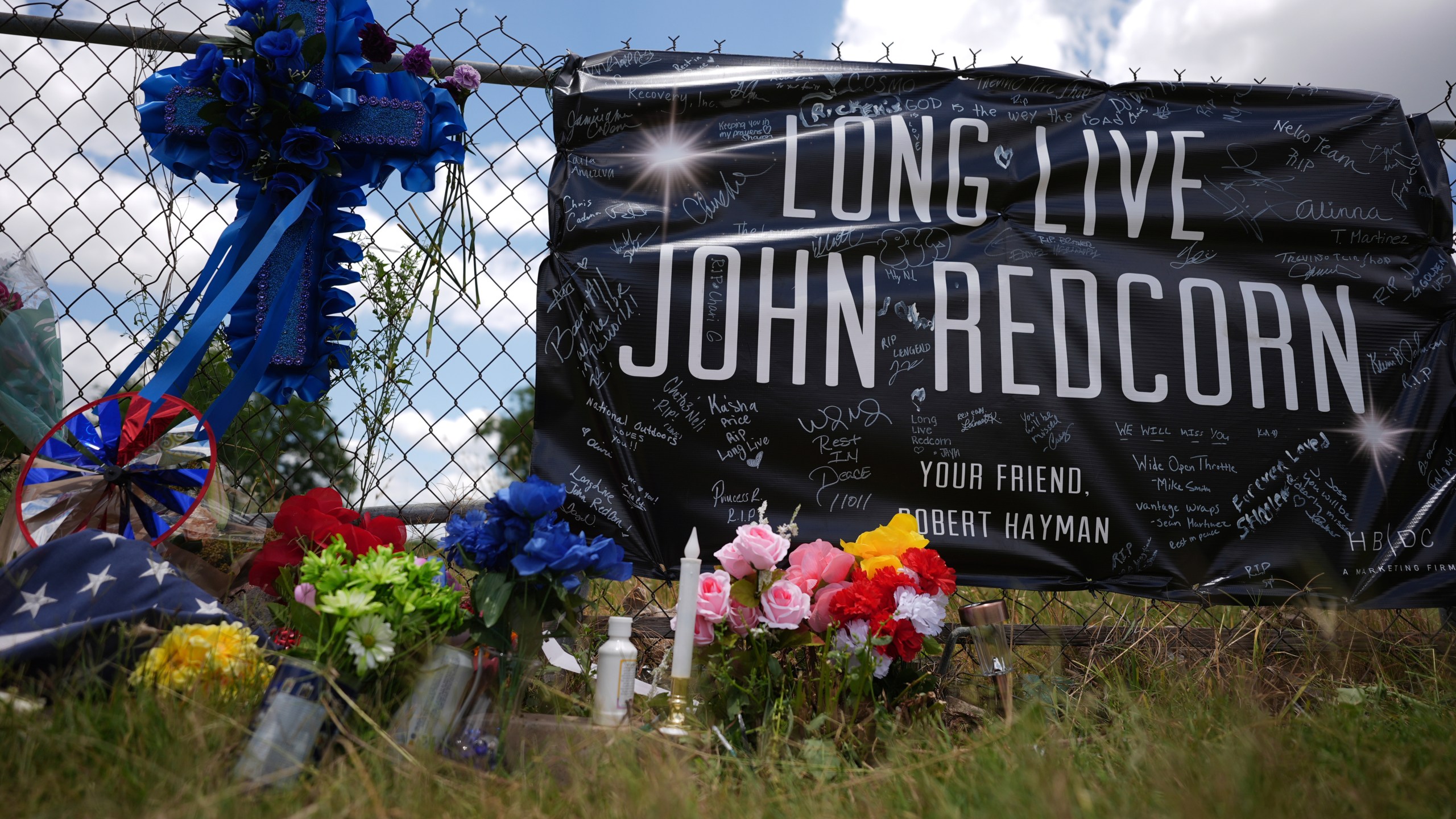 Candles, flowers, and notes are placed at a makeshift memorial in San Antonio, on Thursday, June 5, 2025, for voice actor Jonathan Joss who was recently killed. (AP Photo/Eric Gay)