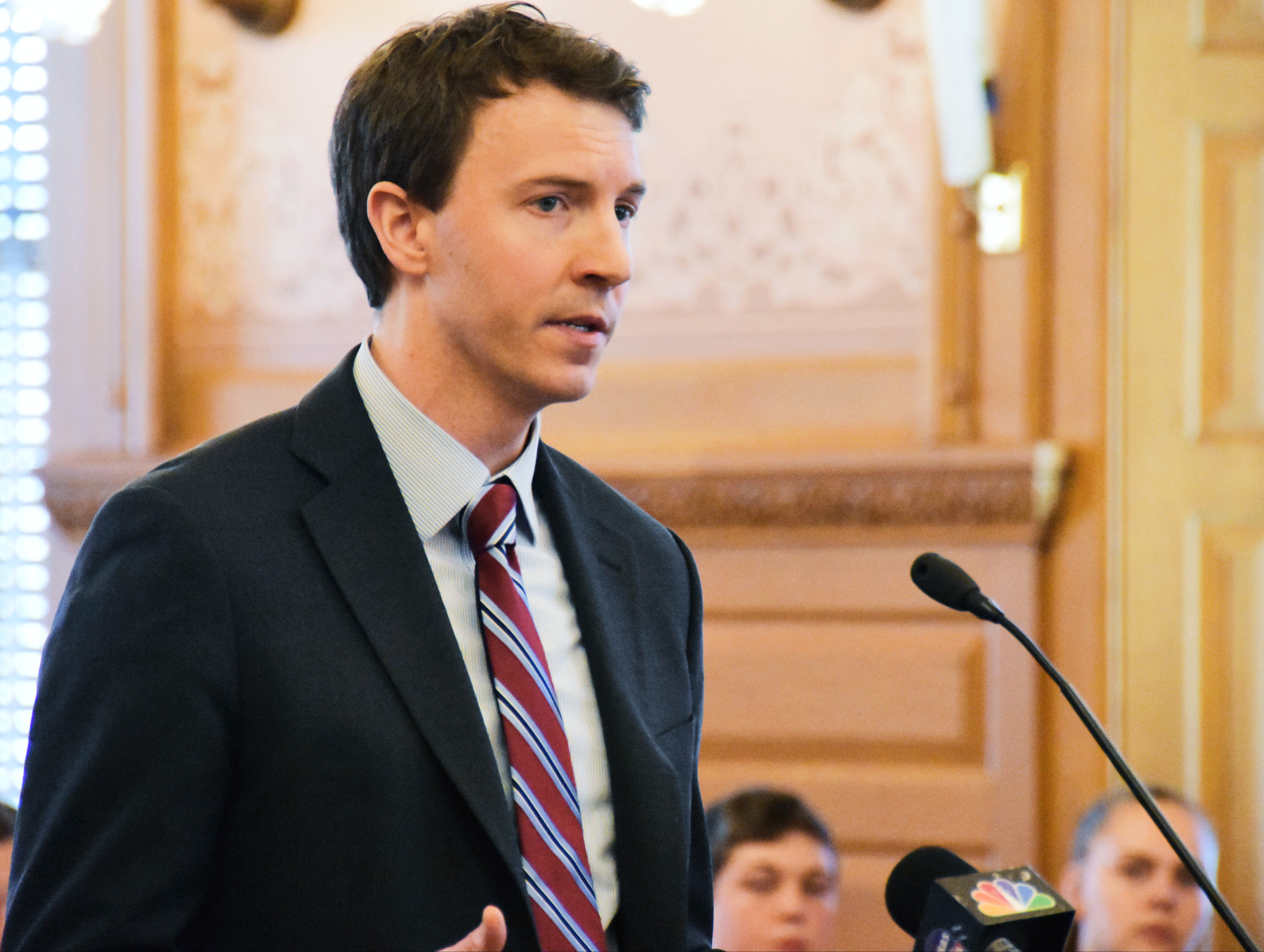 FILE - Bryan Seeley, a Major League Baseball senior vice president, testifies on a bill that would legalize sports betting in Kansas during a legislative committee hearing, March 13, 2018, at the Statehouse in Topeka, Kan. (AP Photo/Mitchell Willetts, File)