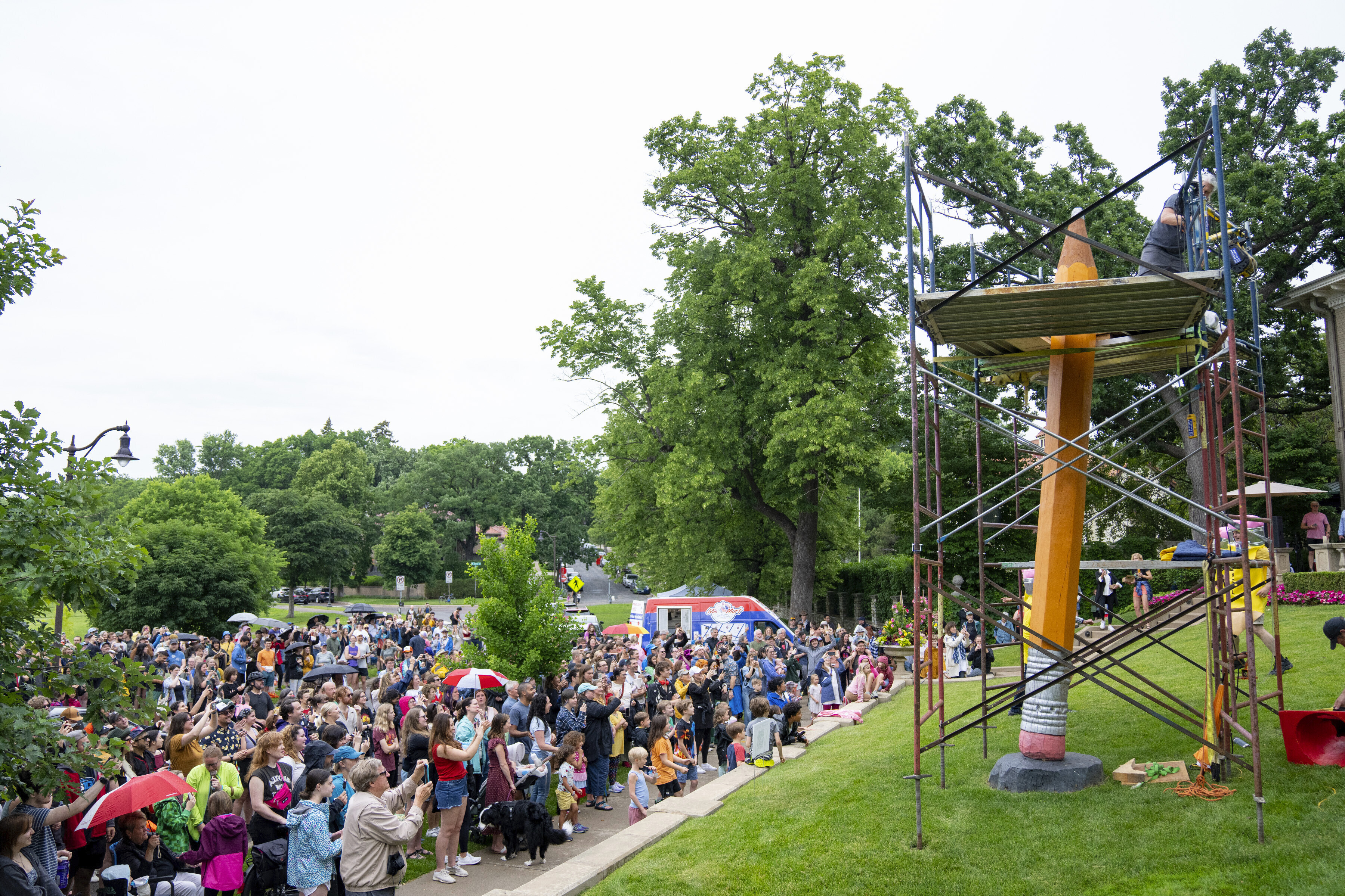 FILE - Hundreds of people gather to watch the 3rd Annual Sharpening of the Lake of the Isles Pencil in Minneapolis on June 15, 2024. (Alex Kormann/Star Tribune via AP)