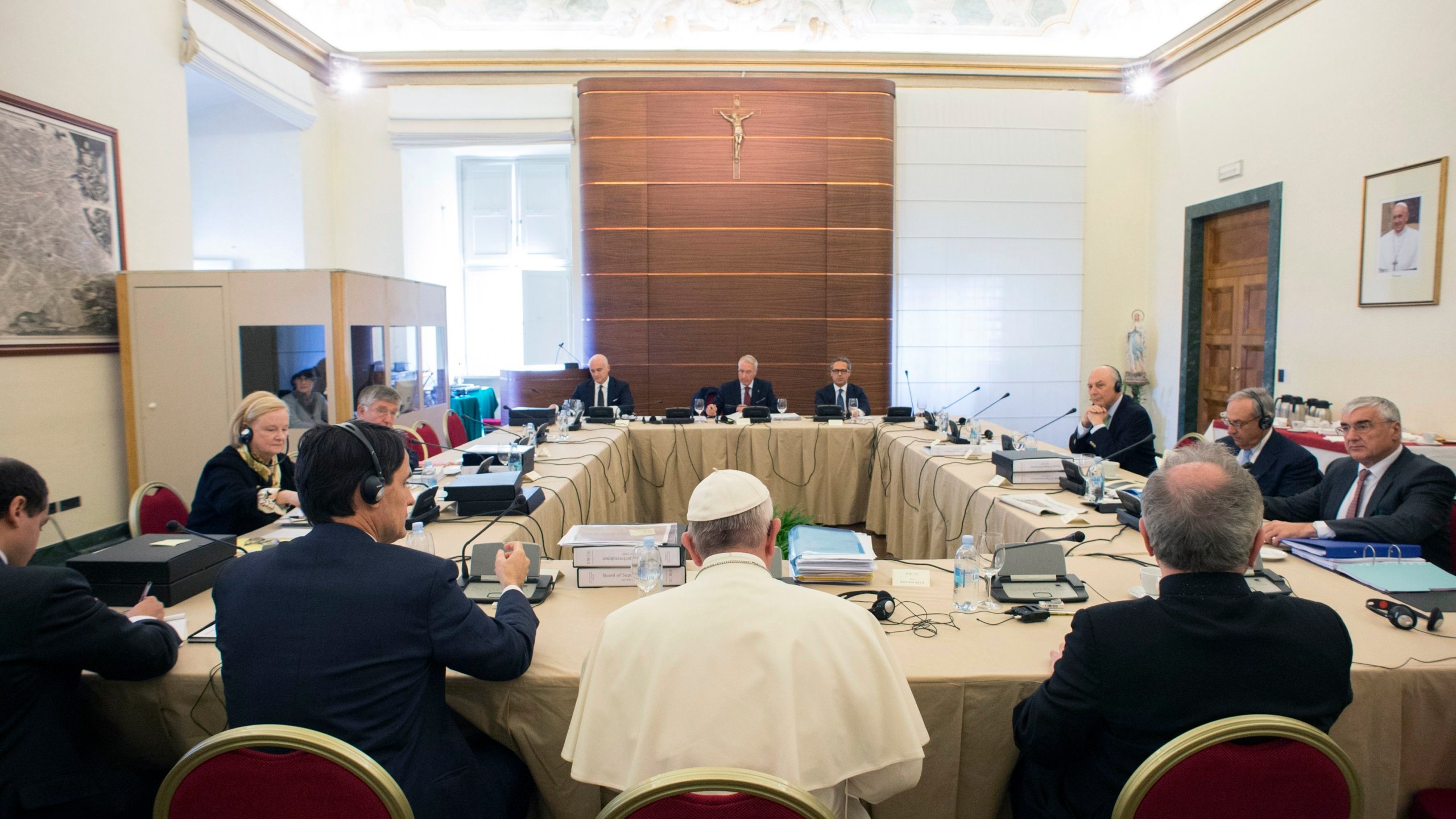 FILE - Pope Francis attends the IOR (Institute for Religious Works) Vatican Bank's council, at the Vatican, Tuesday, Nov. 24, 2015. (L'Osservatore Romano/Pool Photo via AP)