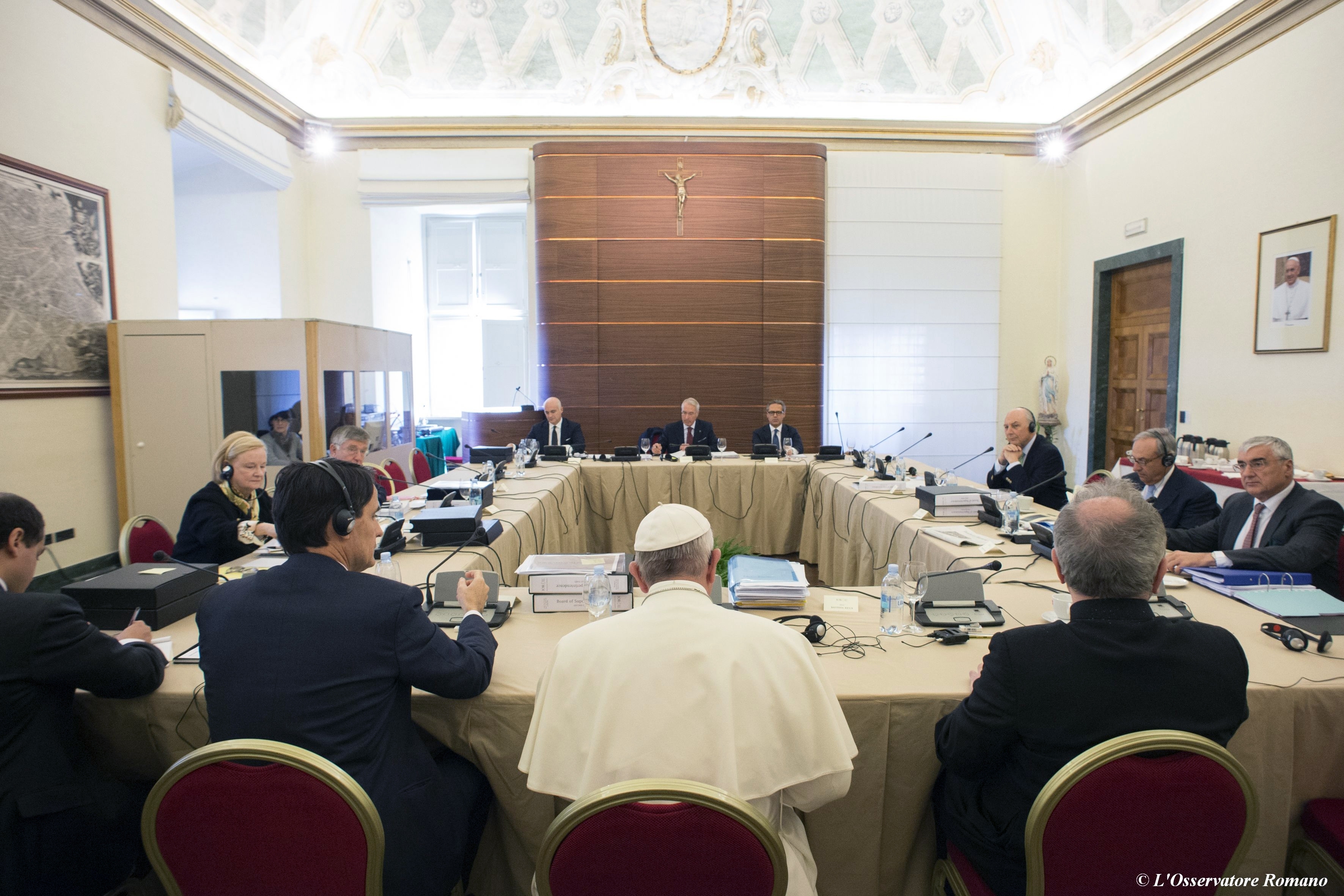 FILE - Pope Francis attends the IOR (Institute for Religious Works) Vatican Bank's council, at the Vatican, Tuesday, Nov. 24, 2015. (L'Osservatore Romano/Pool Photo via AP)