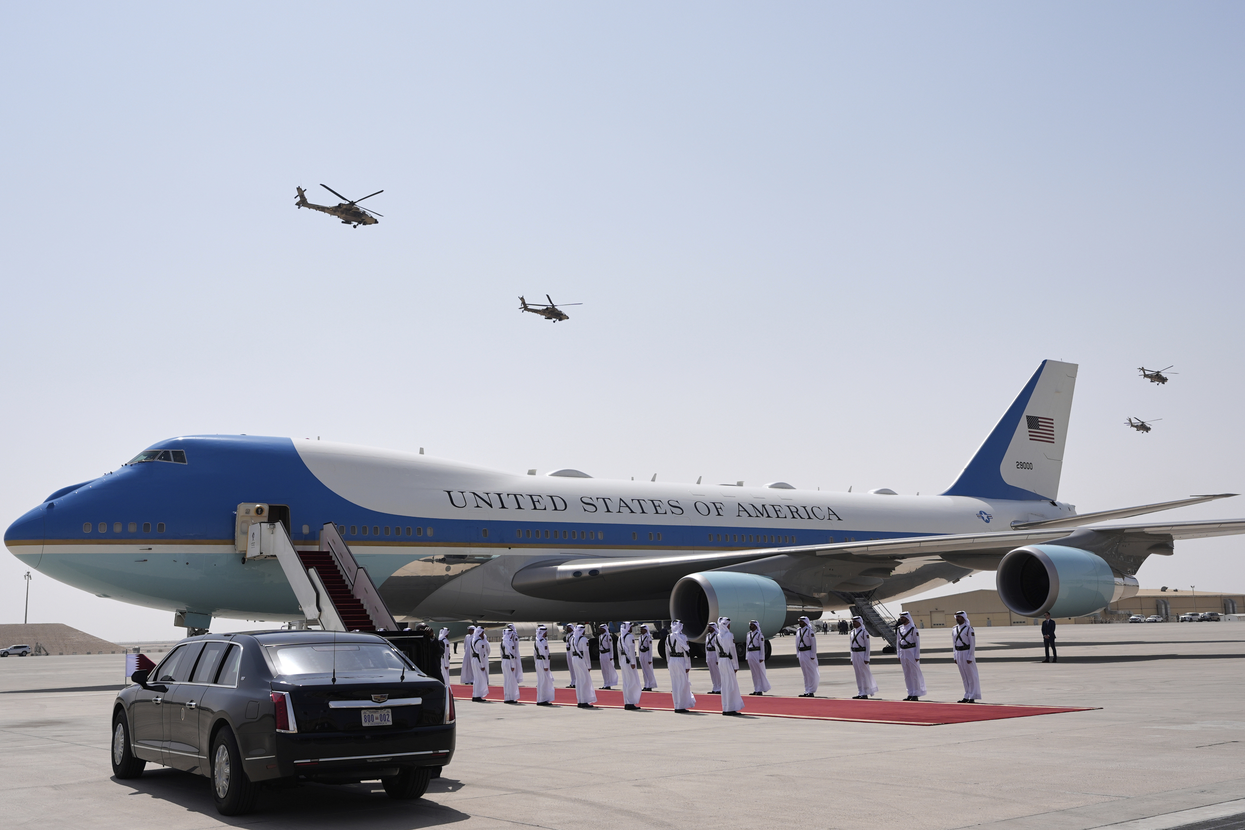 Qatar Air Force Apache gunships perform a flyover as Air Force One is ready to depart from Al Udeid Air Base, Thursday, May 15, 2025, in Doha, Qatar. (AP Photo/Alex Brandon)