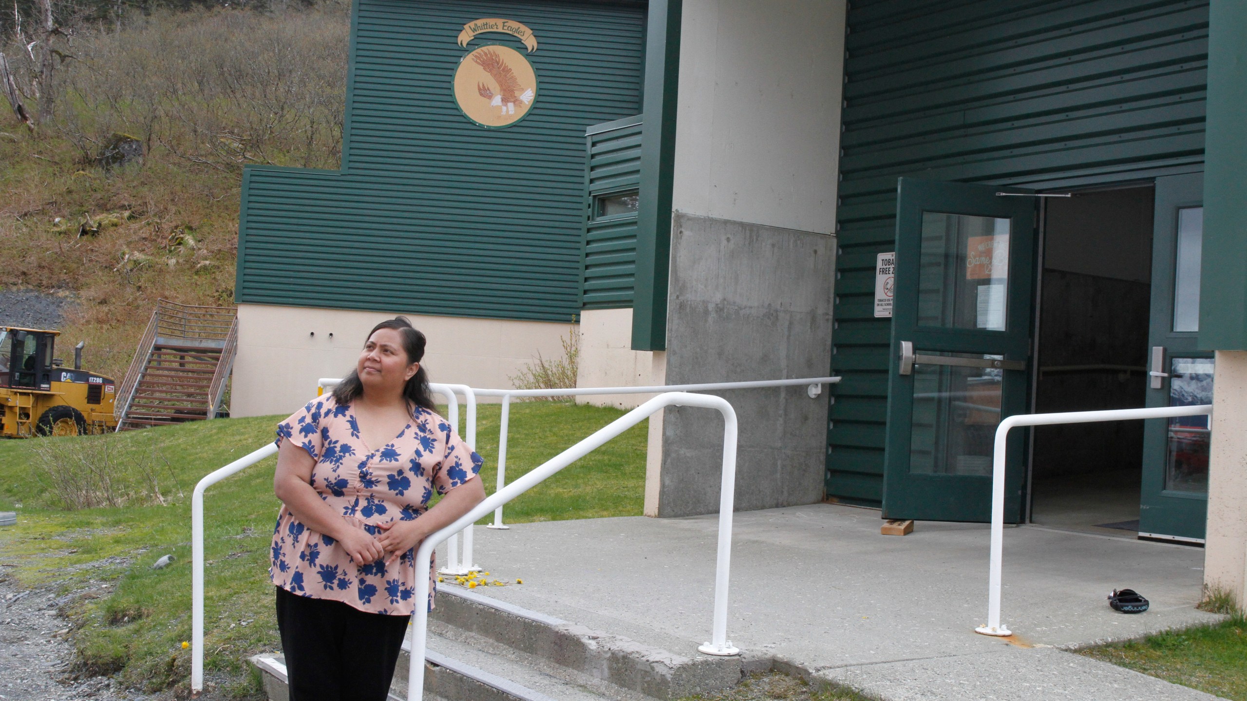Tupe Smith poses for a photo outside the school in Whittier, Alaska, May 13, 2025. She was elected to the school board in 2023 but a week later was told she could not serve because as a native of American Samoa, she is a U.S. national but not a U.S. citizen. (AP Photo/Mark Thiessen)